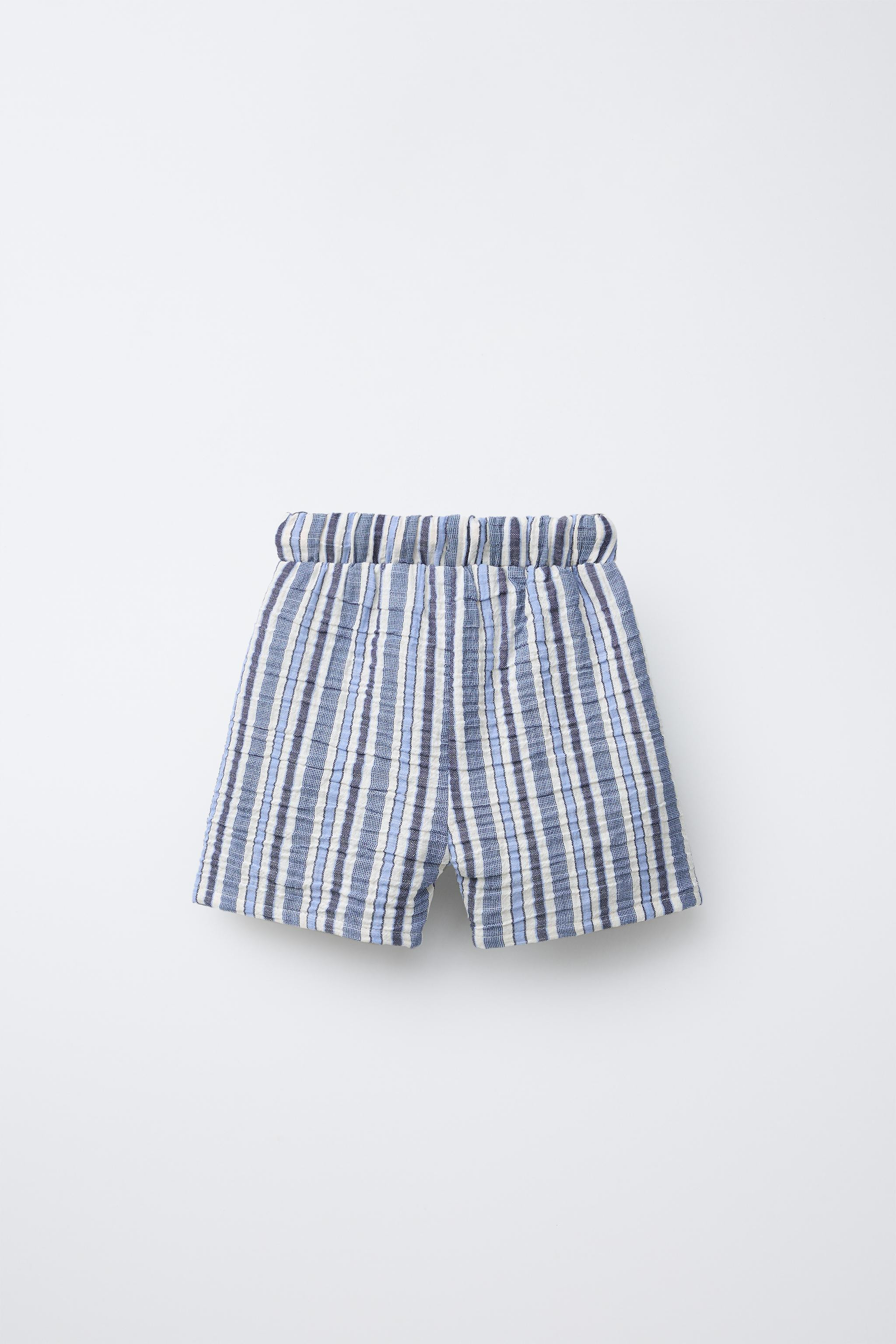 Textured shorts with elastic waistband and adjustable front drawstring. Front pockets and striped... | Zara US