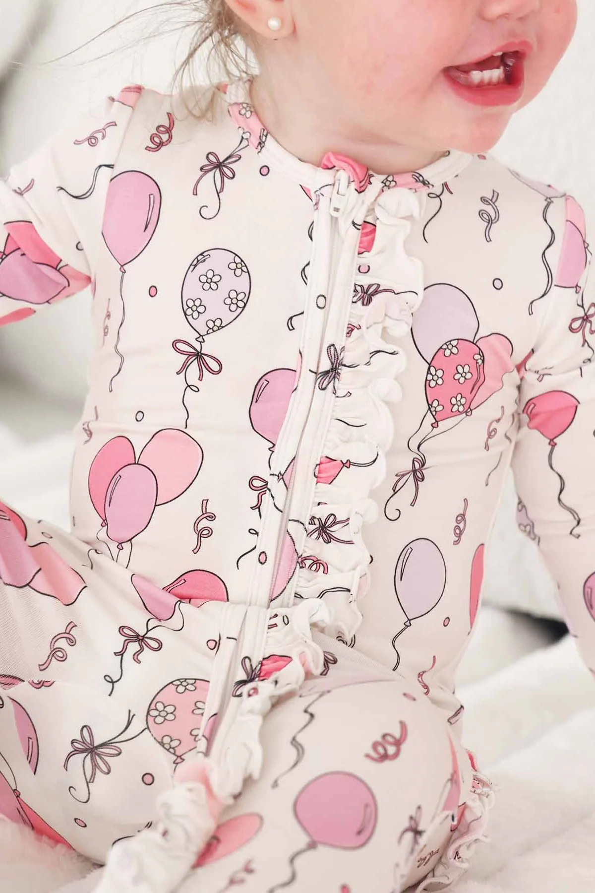 Party Time Ruffle Zipper Footie | Pink | Caden Lane