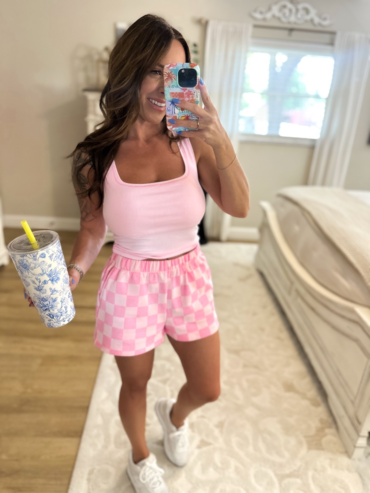 Tank, sneakers, & phone case all from Amazon! Shorts from Tennessee Jane 🤍
