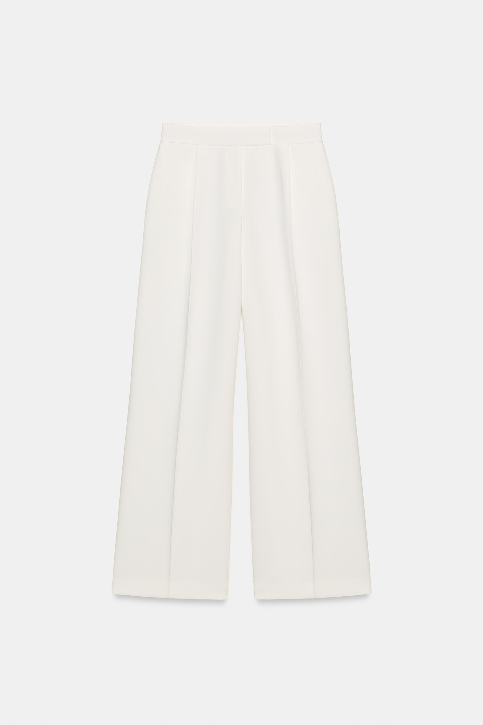 High-waist trousers with front darts. Featuring front pockets and false flap pockets at the back.... | Zara UK