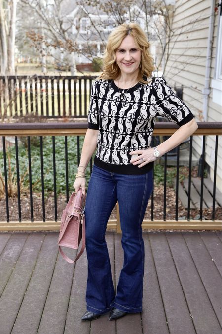 Transitioning my favorite flare jeans to spring with these chic tops. 🌸🌿 I am wearing both now because it’s been really warm and hot flashes are my constant companion. 🔥 Head to the link in bio for the scoop on both looks. Have a fantastic day! 

#LTKstyletip #LTKfindsunder100