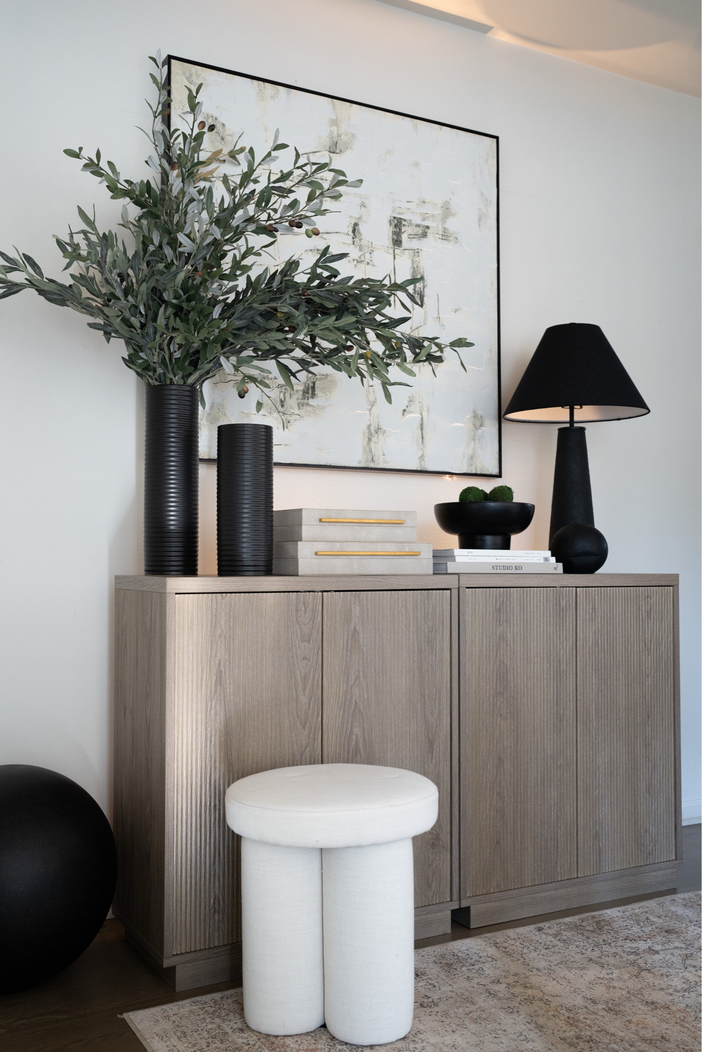 Awkward spaces can be a challenge but with a few hacks like these slim cabinets, oversized art, and greenery and a rug a space can really be brought to life!

#LTKHome #LTKMostLoved #LTKStyleTip