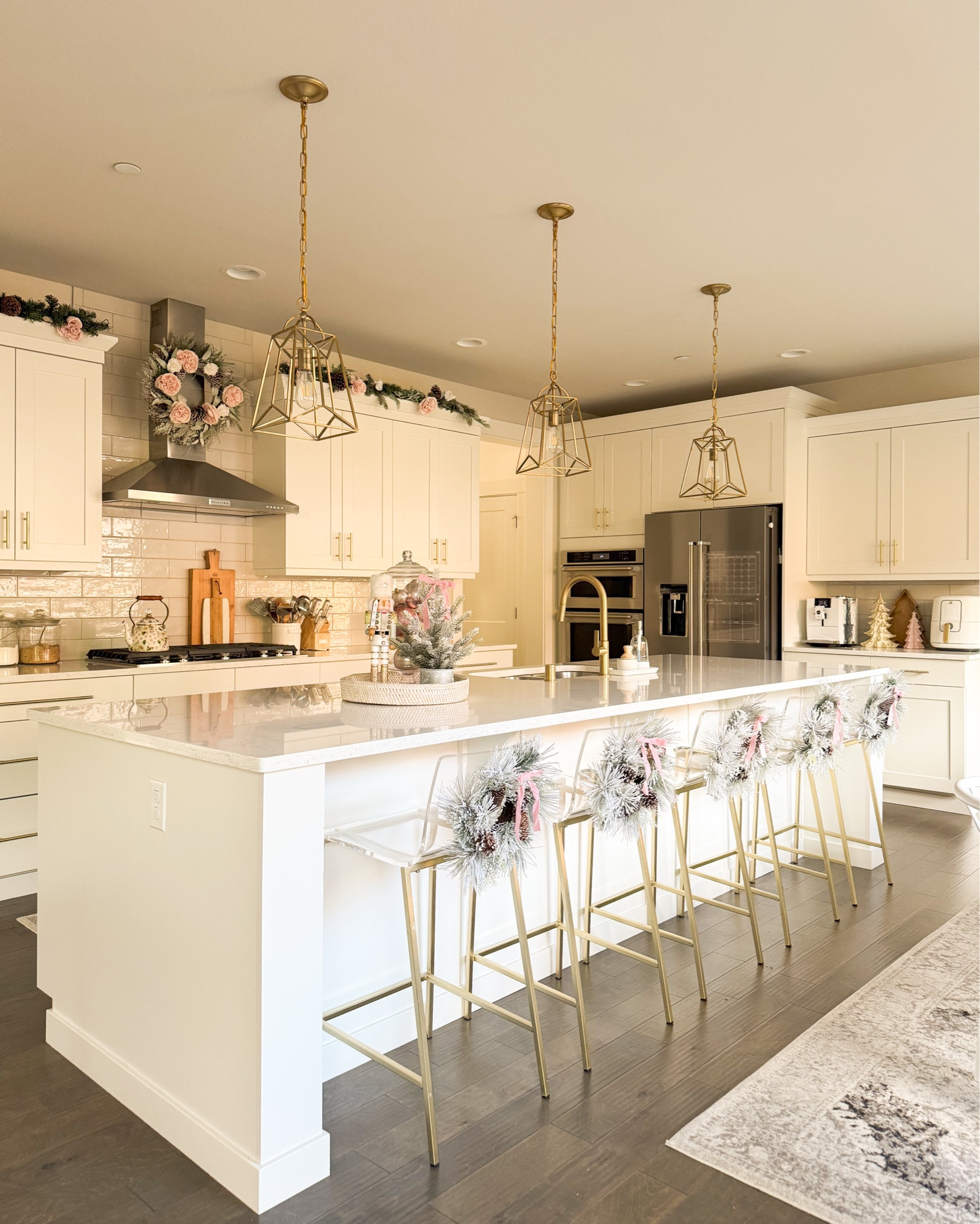 Kitchen Christmas decor! Holiday decor 

cutting board, home decor, bar stool, Christmas wreath, pink bows, cabinet hardware, glass jar, serving tray, charcuterie board 

#LTKHoliday #LTKHome #LTKSeasonal