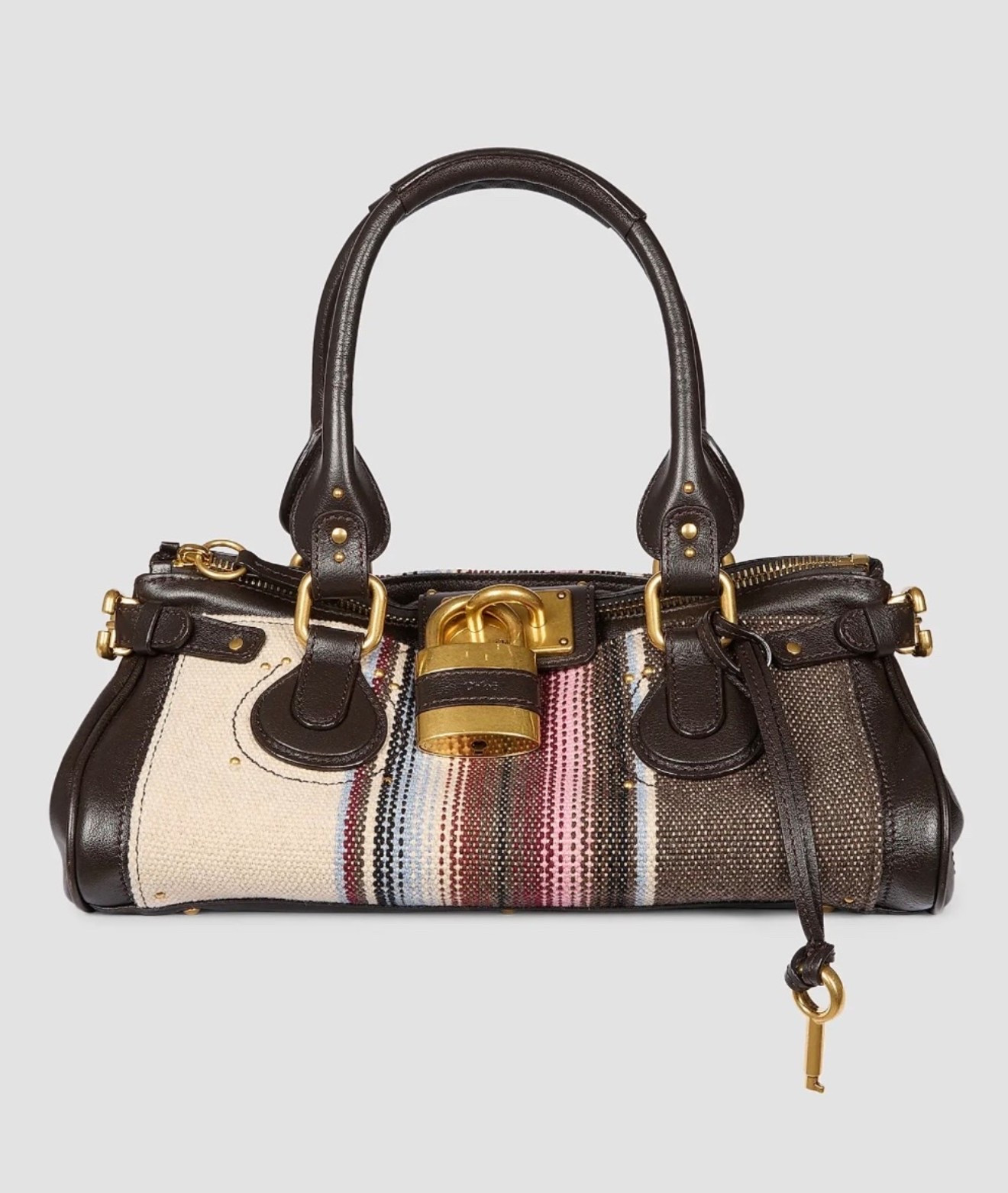 Chloé

Paddington Striped Leather Shoulder Bag

An exploration of archival house codes, the latest collection from Chloé captures a refined bohemian sensibility through tactile contrast. Cascading tiers of voluminous tulle and floral-embroidered ruffles temper the relaxed silhouette of balloon-leg trousers.

#LTKootd #LTKWorkwear #LTKTravel