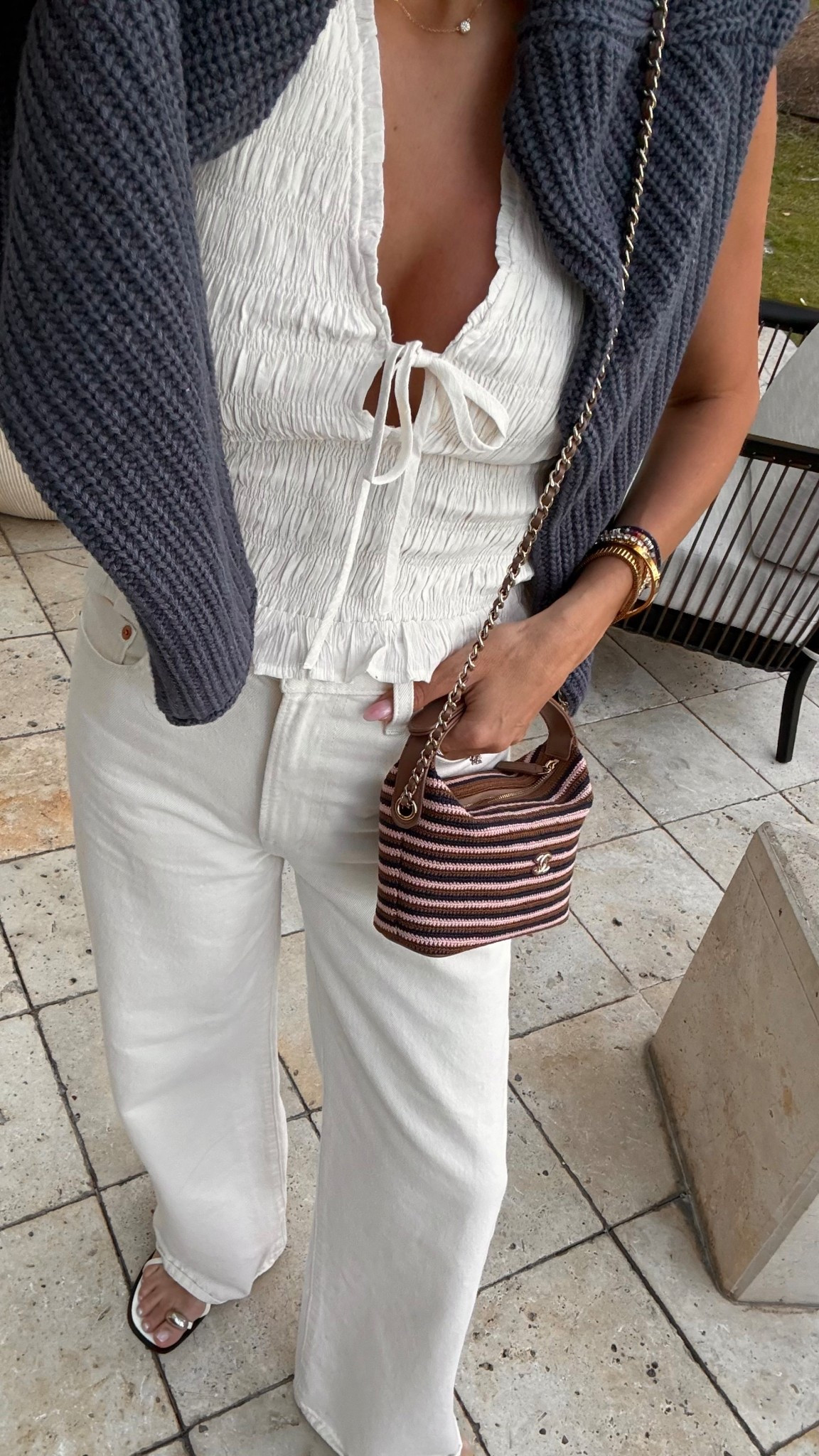 Spring vacation outfit 🤍

White jeans from @levis @amazon 
White tie top from @abercrombie 
Sweater from @target @targetfashion
Necklace from @quince 
Sandals from @zara 

#LTKOver40 #LTKootd #LTKSeasonal