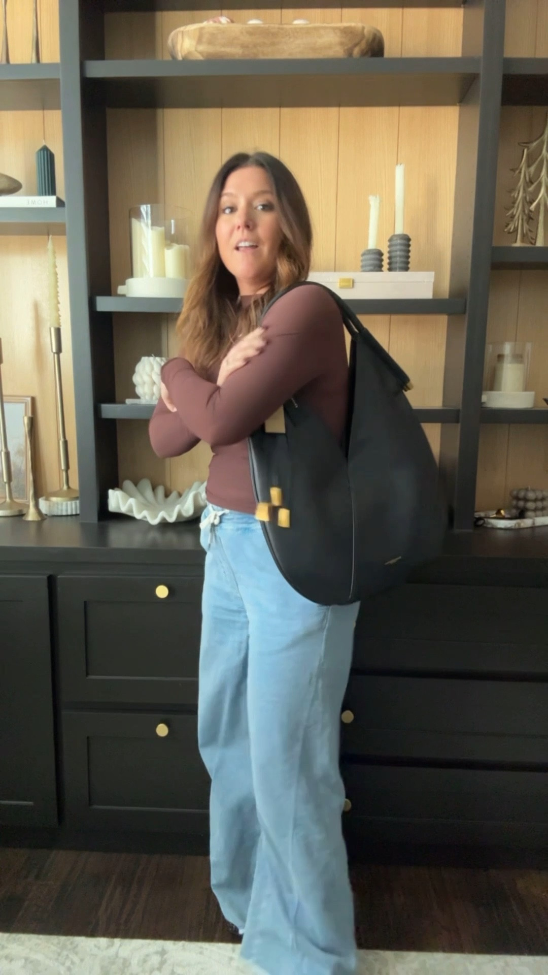 Affordable fall outfit idea! The bag is a bit of a splurge but on sale now!! The wide legs jeans feel like sweatpants! They’re so comfortable from American Eagle! The top and shoes are Amazon! The brown on the top is gorgeous and this is a great basic that could be dressed up or down! And the bag!!! Y’all! I’m obsessed!!! Great everyday black tote! Can easily be dressed up or down  

#LTKgrwm #LTKWorkwear #LTKMidsize