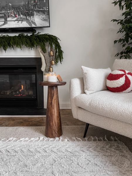 Cozy holiday decor for our living room. Love the peppermint pillow for our white boucle accent chair!

Boucle accent chair, christmas throw pillow, holiday decor, simple Christmas decor, living room decor, layered rugs, garland, Norfolk pine garland, fireplace mantle decor, neutral Christmas stockings, end table, TJ Maxx find, fireplace decor, Christmas styling 

#LTKSeasonal #LTKHoliday #LTKhome