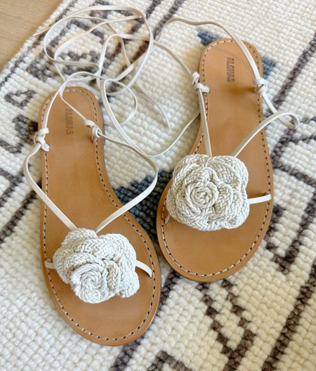 Cutest flower adorned lace up neutral sandals! I did a 37 and am a 6.5 and they fit perf. 

#LTKSeasonal #LTKshoecrush #LTKtravel
