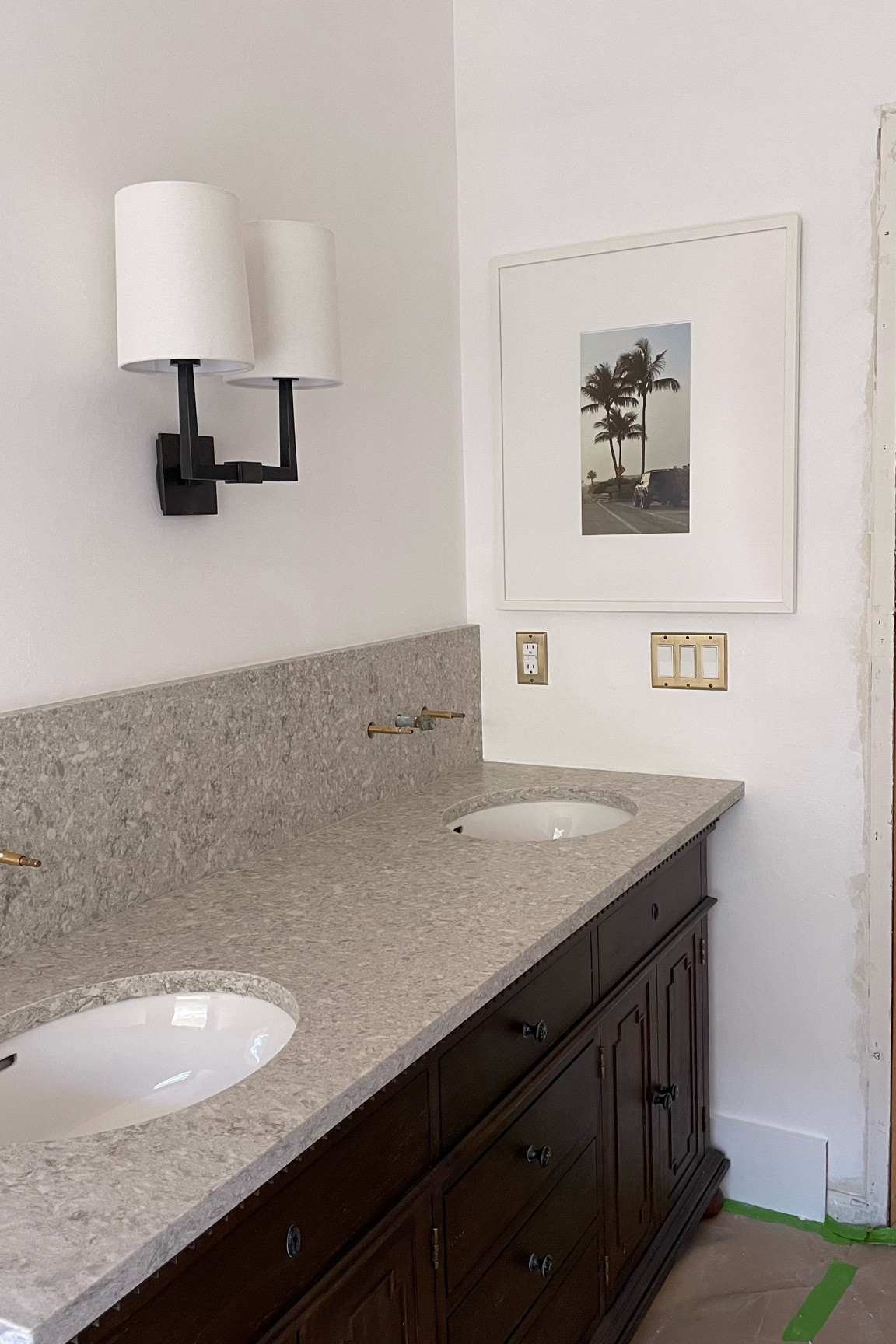 Bathroom double sconce, brass outlet covers

#LTKhome