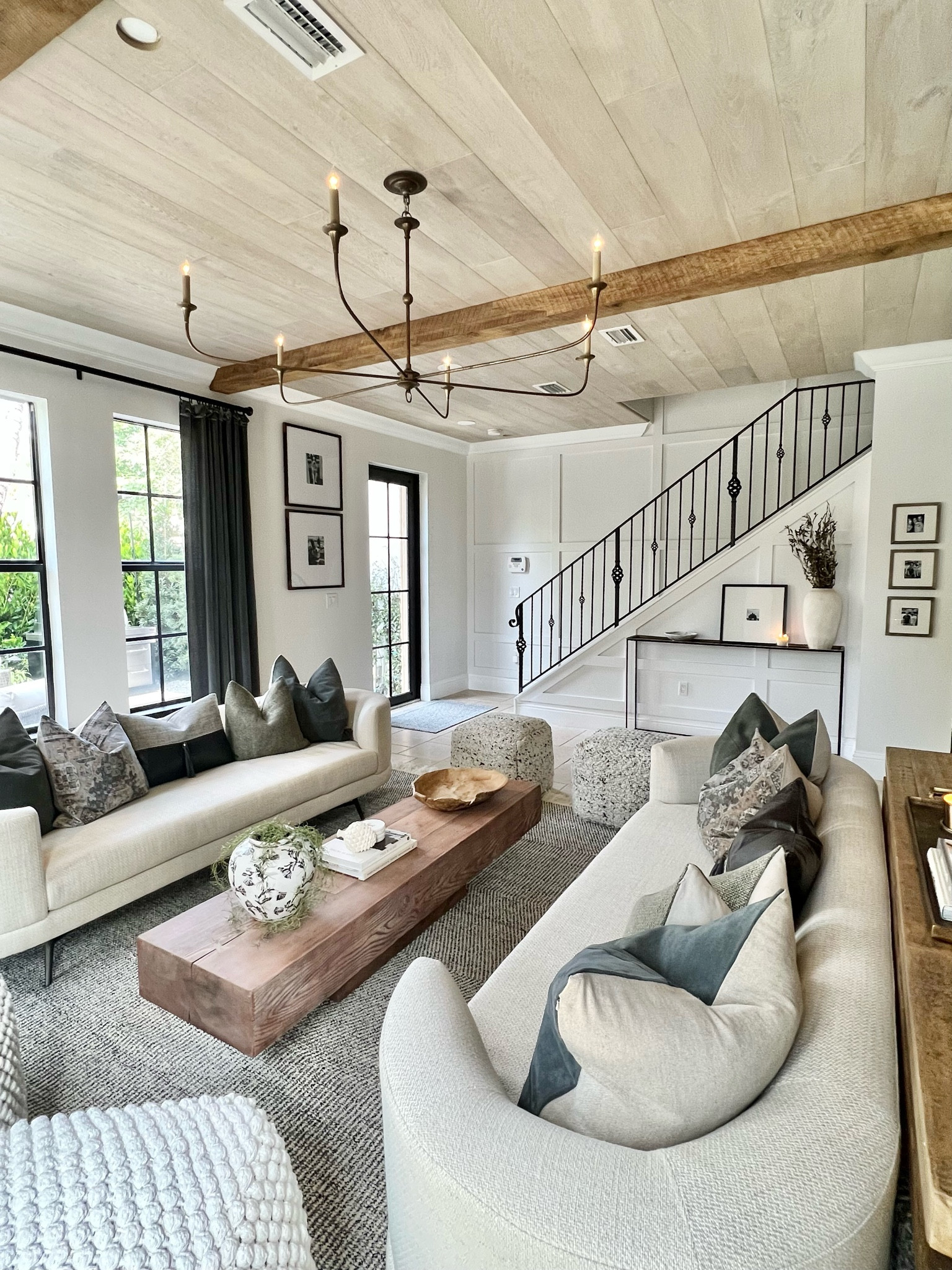 The kind of living room you want to live in! Don’t be afraid to go wild with layering textures. Here I added wood paneling and beams to the ceiling, mixed poufs, mixed throw pillows, added velvet curtains, and made sure my decor was all different materials to give it the feel of clean while also cozy! 

#LTKSale #LTKfamily #LTKhome