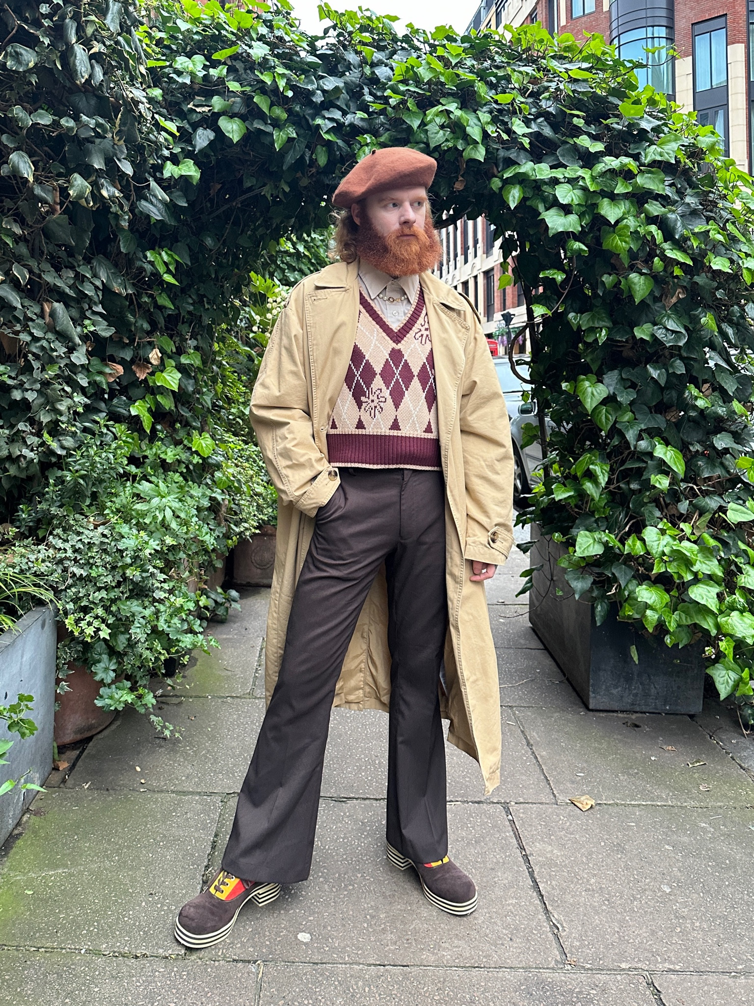 Brown beret, patterned sweater vest, knitted vest, brown flared trousers, beige trench coat, asosx Levi’s 

#LTKeurope #LTKSeasonal #LTKstyletip