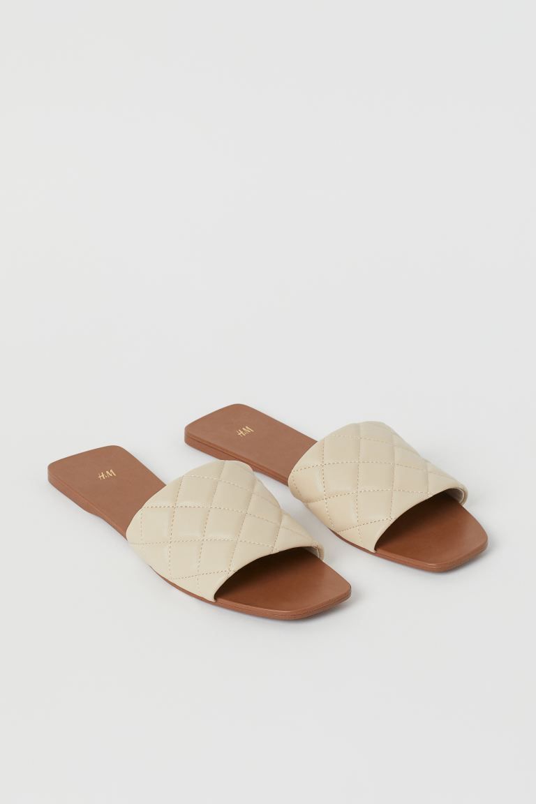 Slides in faux leather with a wide, quilted foot strap and angular sole. Jersey lining and faux l... | H&M (US + CA)