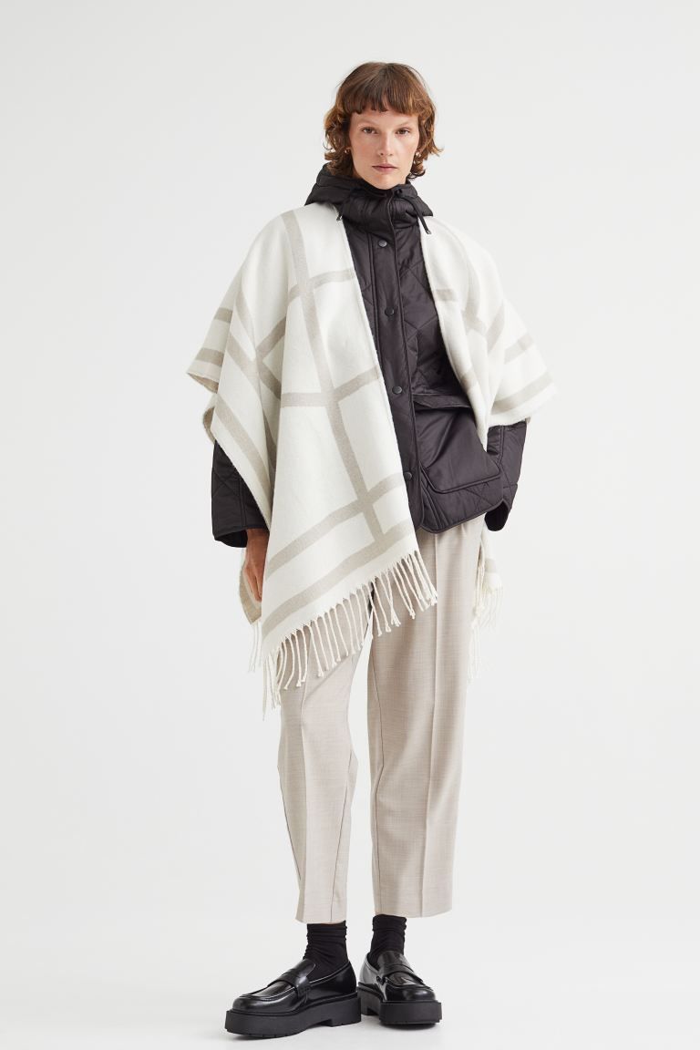 Fringe-trimmed poncho | H&M (UK, MY, IN, SG, PH, TW, HK)