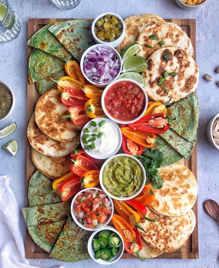 Quesadillas are a classic Mexican comfort food, and, beyond being one of my favorite Mexican-inspired snacks, they are super easy to make. This board is designed to make your next fiesta fun and delicious without all of the fuss of a traditional dinner party–it’s all about the dips and toppings! Also, it pairs really well with my delicious margaritas and this Mexican-Inspired Charcuterie Board.

#LTKfoodie #LTKSeasonal