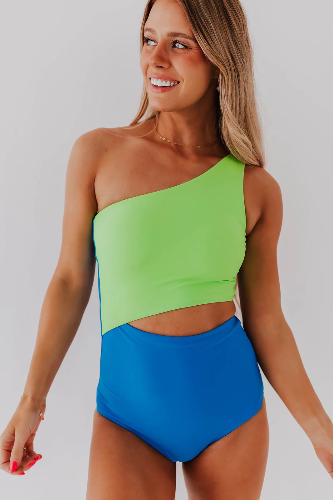 RILEY CUT OUT ONE PIECE IN NEON BLUE AND GREEN COLOR BLOCK BY BETSY MIKESELL X PINK DESERT | Pink Desert