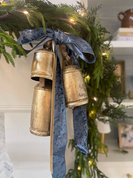 Christmas mantel - garland, bells, ribbon and white lights // #christmasdecor #christmasbells #garland

#LTKHoliday #LTKhome #LTKSeasonal