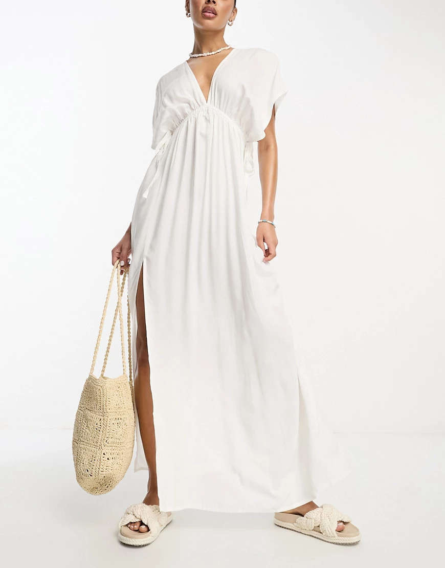 ASOS DESIGN flutter sleeve maxi beach dress with channelled tie waist in white | ASOS (Global)