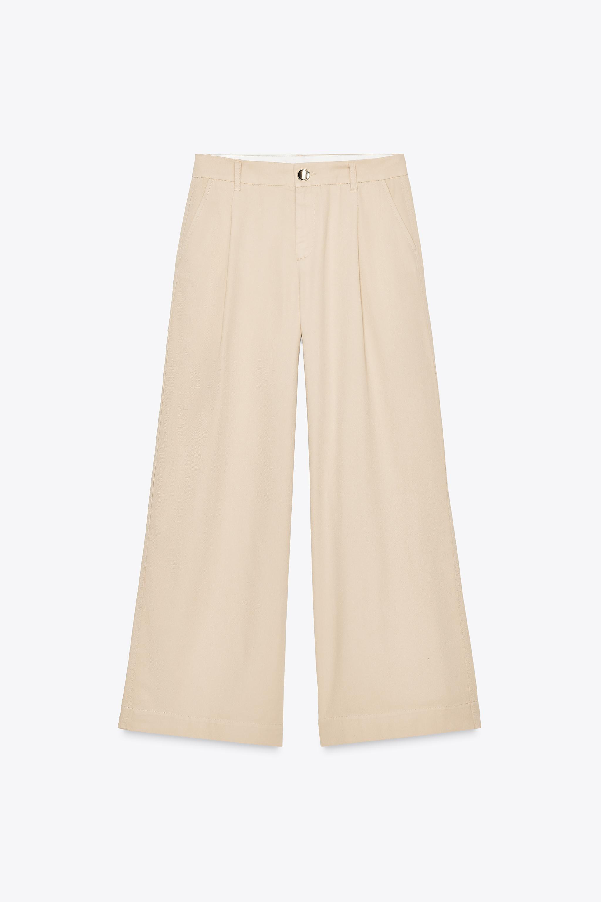 High-waisted pants with front pleats. Front pockets and back false welt pockets. Wide leg. Front ... | Zara US