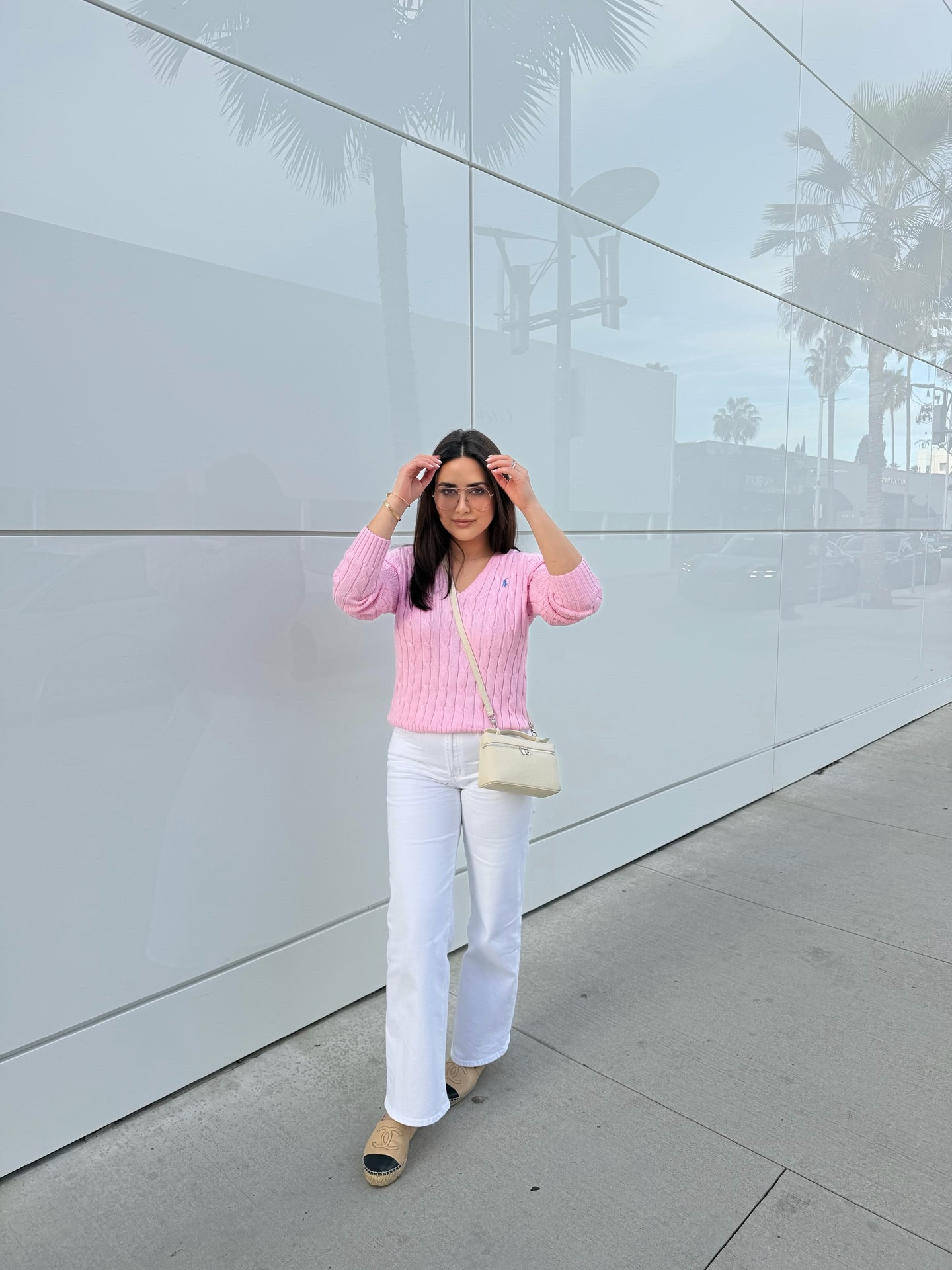 Soft pre-spring vibes in Beverly Hills 🤍🌸
White relaxed denim paired with a blush pink V-neck cable knit polo from Ralph Lauren for that effortless, polished feel. Paired with classic Chanel espadrilles and pink-tinted aviator sunglasses by Elisa Johnson. Easy, simple, and perfect for easing into warmer days.


#outfitinspo #outfitideas #personalstylist #wardrobestylistla #rodeodrive

#LTKWorkwear #LTKootd #LTKdayinmylife