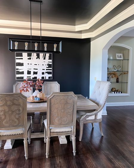 Dining room with a touch of fall decor 🍂

Living room. Fall decor. Shelf styling. Black and white dining room. Dining room decor. Dining room table. Modern rustic home decor. Autumn decor. 

#LTKhome #LTKSeasonal