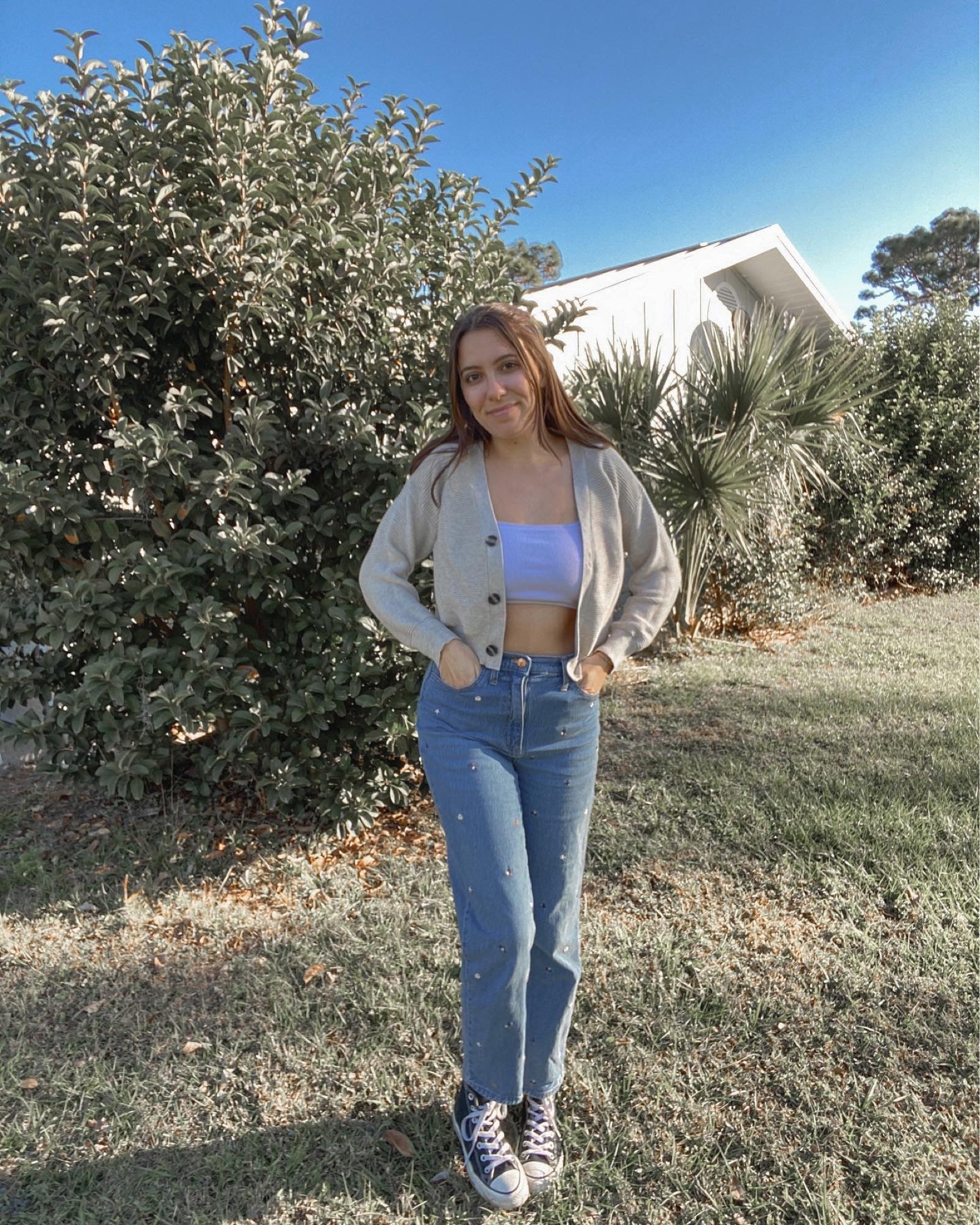 white crop top, sweater, embroidered flower jeans

#LTKfit #LTKFind #LTKstyletip