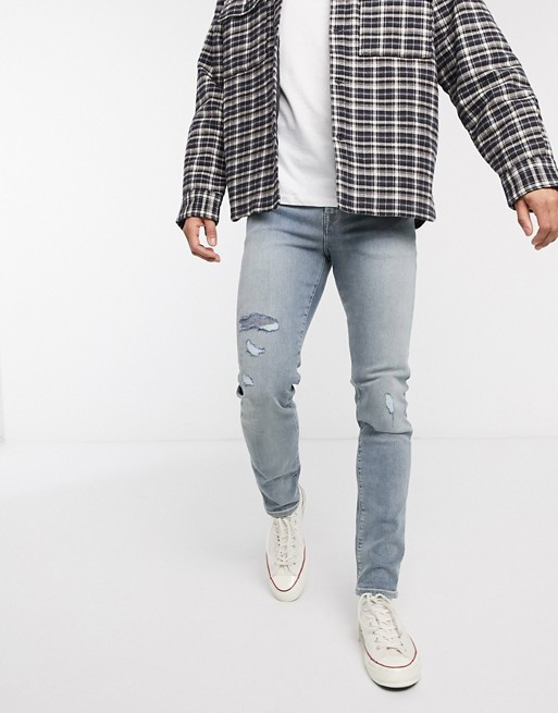 ASOS DESIGN – Enge Jeans im Used-Look in verwaschenem Mittelblau, 12,5 Unzen | ASOS DE