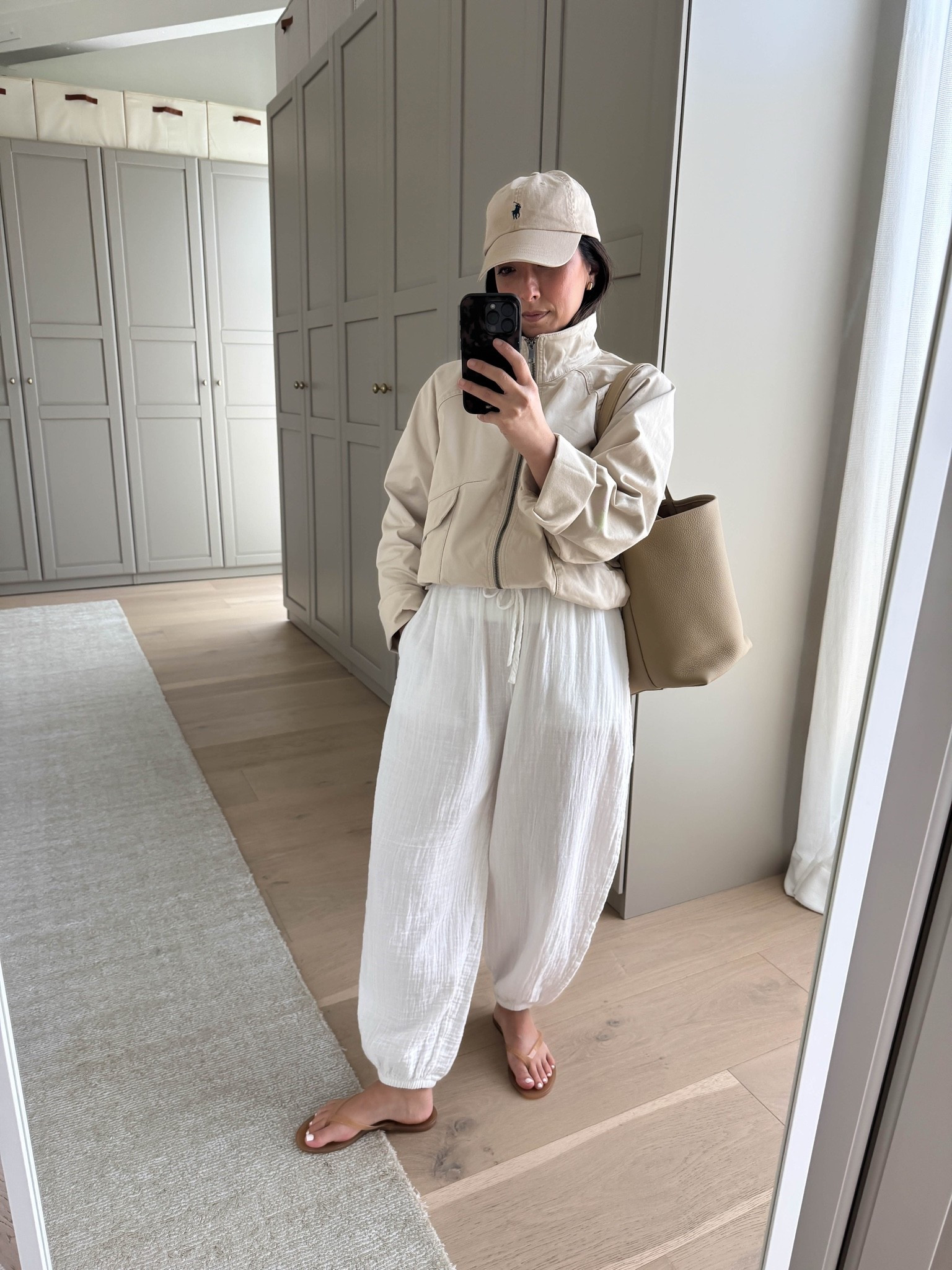 The drop-off outfit nobody told you about. Easy mom outfits to wear to drop off. These gauze pants feel like you’re wearing nothing so great for warm weather. 

Aritzia tee medium
Aritzia balloon pants xs
Joe’s jacket small. But could wear the xs
Polo hat
The Row bag medium
Black Suede studio sandals 35

Summer outfits, petite style, spring outfits 2026

#LTKmomlife #LTKootd #LTKPetite