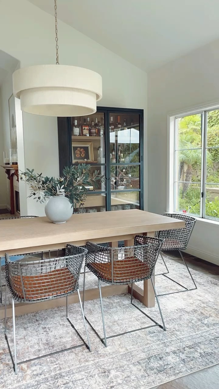 Dining room view 🙌🏻

#diningtable #arearug #barcabinet #curiocabinet #barreldiningchair 

#LTKhome