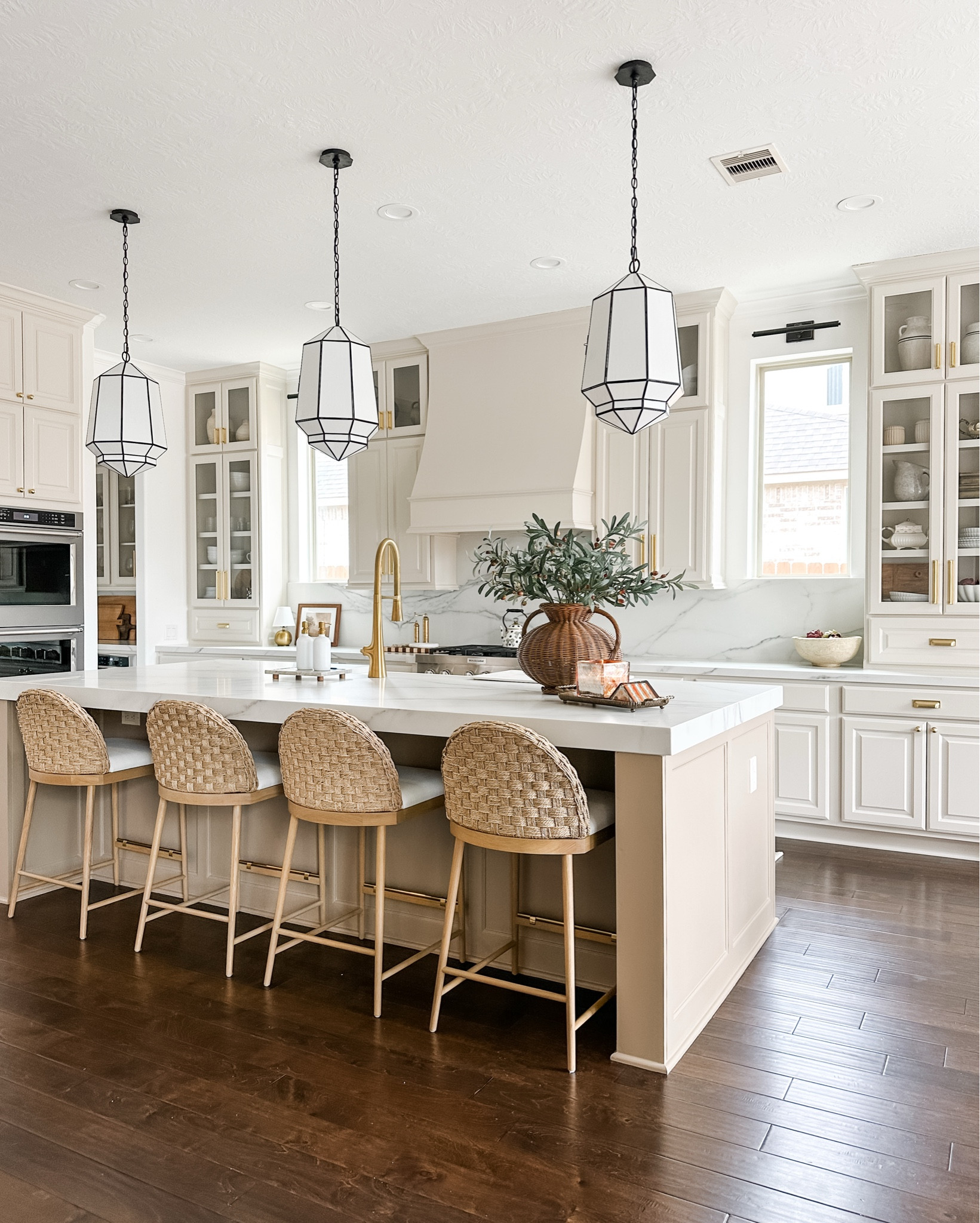 Kitchen renovation details… neutral kitchen, creamy kitchen, traditional kitchen, studio McGee, woven counter stools, black kitchen pendants.

Cabinet Color: Natural Tan
Island Color: Sanderling 
Both by Sherwin Williams 

#LTKHome #LTKStyleTip