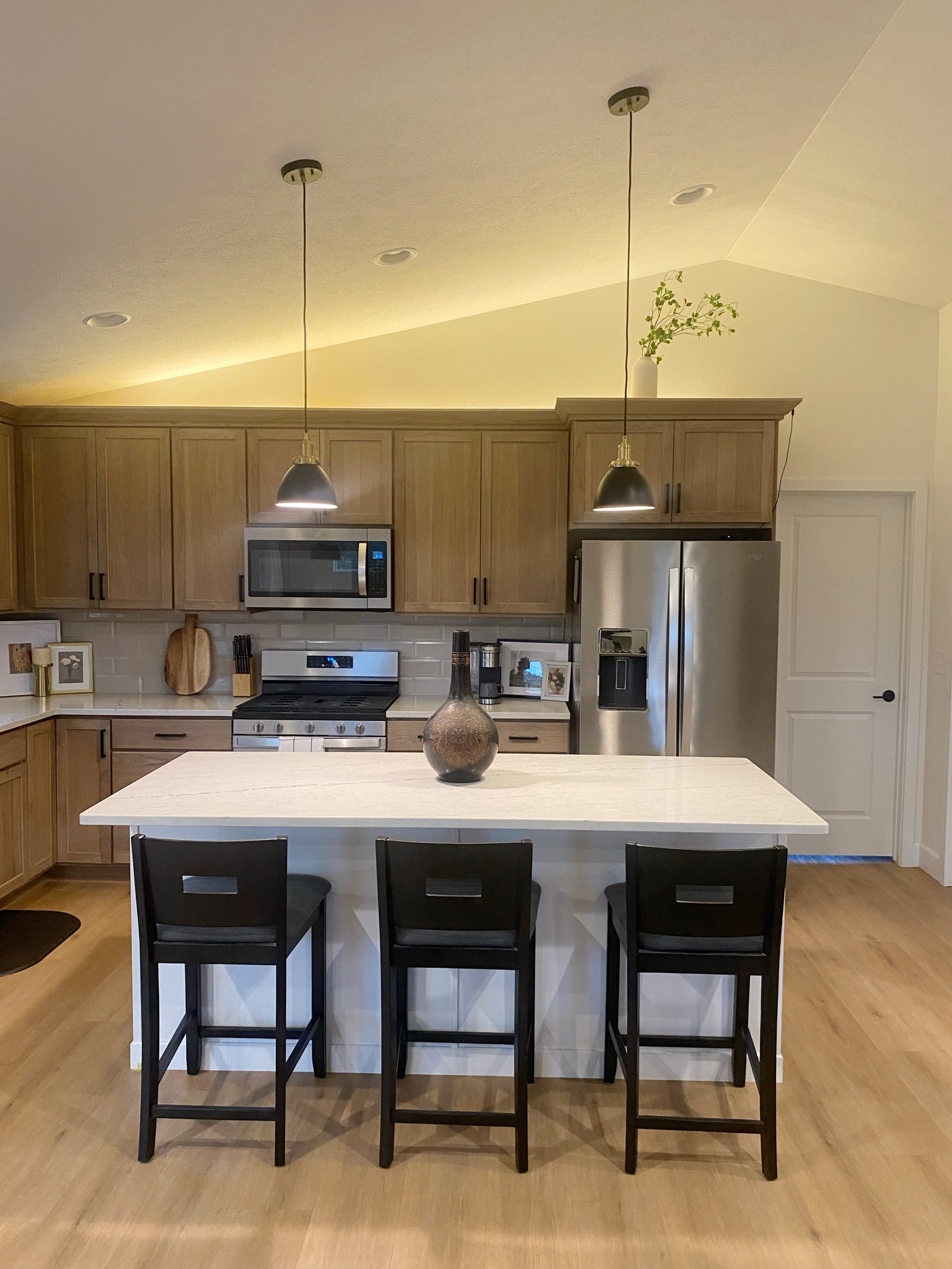 I added this LED light strip along the top of my cabinets and I’m obsessed with how it looks! It plugs into the outlet on the backsplash next to the fridge and then I hid the cord behind some decor on the counter. I’m thinking about adding another one underneath my cabinets to add even more ambiance

#LTKhome