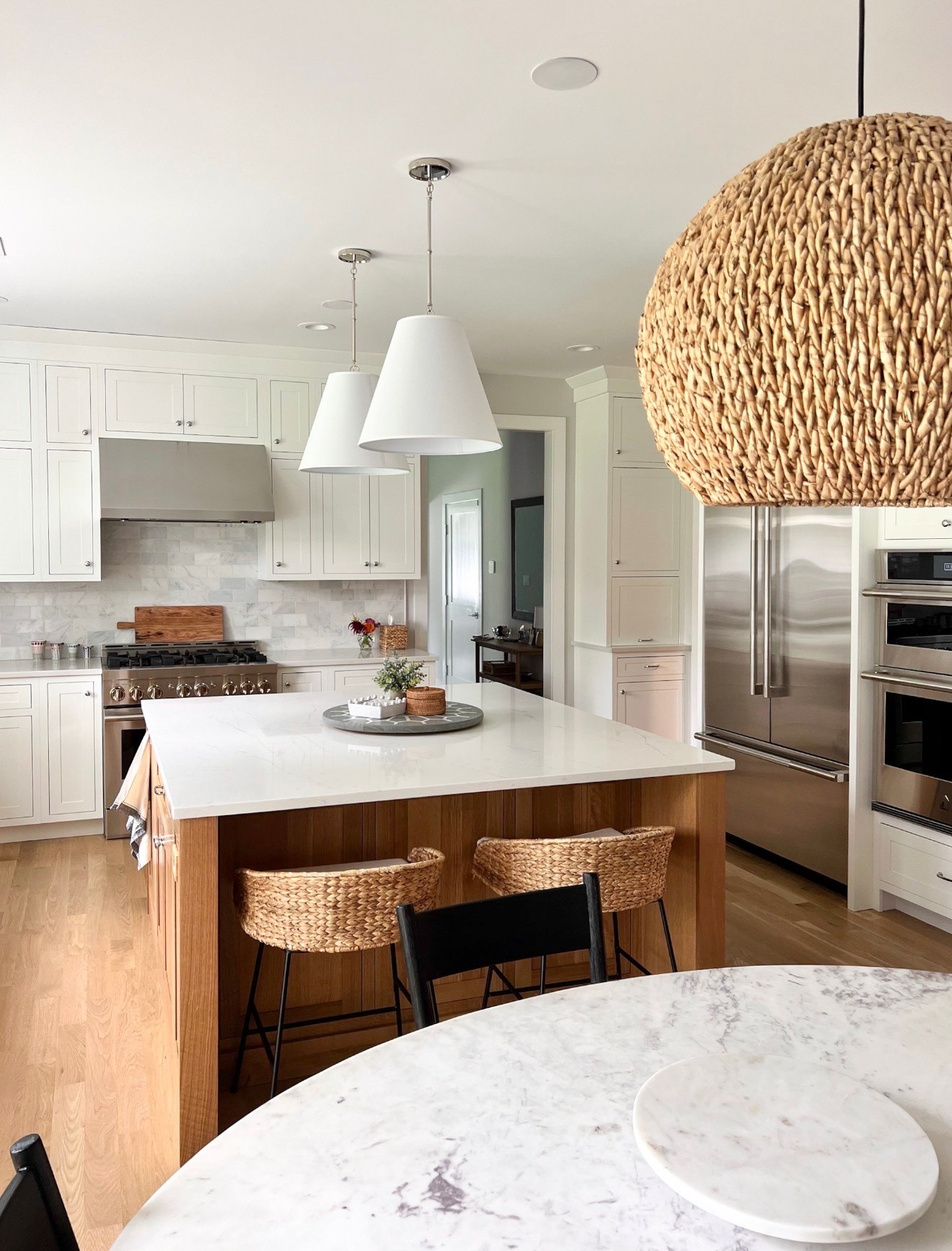 One of my favorite ways to add character to a kitchen is through lighting. I love the mix of the classic white pendants and the woven statement fixture, it brings in texture, warmth, and interest while keeping the space feeling bright and timeless. Lighting truly has the power to make a room feel custom.

kitchen lighting, pendant lighting, woven pendant, statement lighting, kitchen design, coastal kitchen, home decor, interior design, kitchen inspiration, lighting ideas, girlonthehudson

#LTKHome #LTKSeasonal #LTKdayinmylife