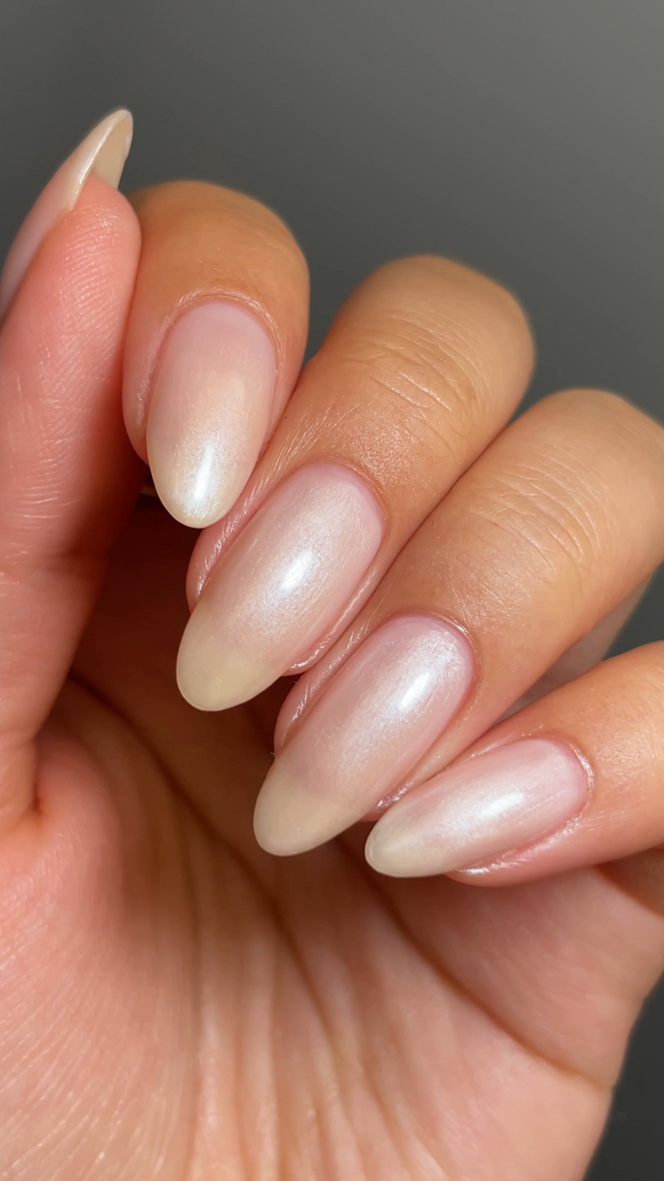 Pearl nail polish can be sponged on for a chrome-like effect, no powder needed! I sponged one layer of pearl over a sheer base. This mani would be perfect for weddings and everyday wear. 

#LTKbeauty #LTKVideo #LTKwedding