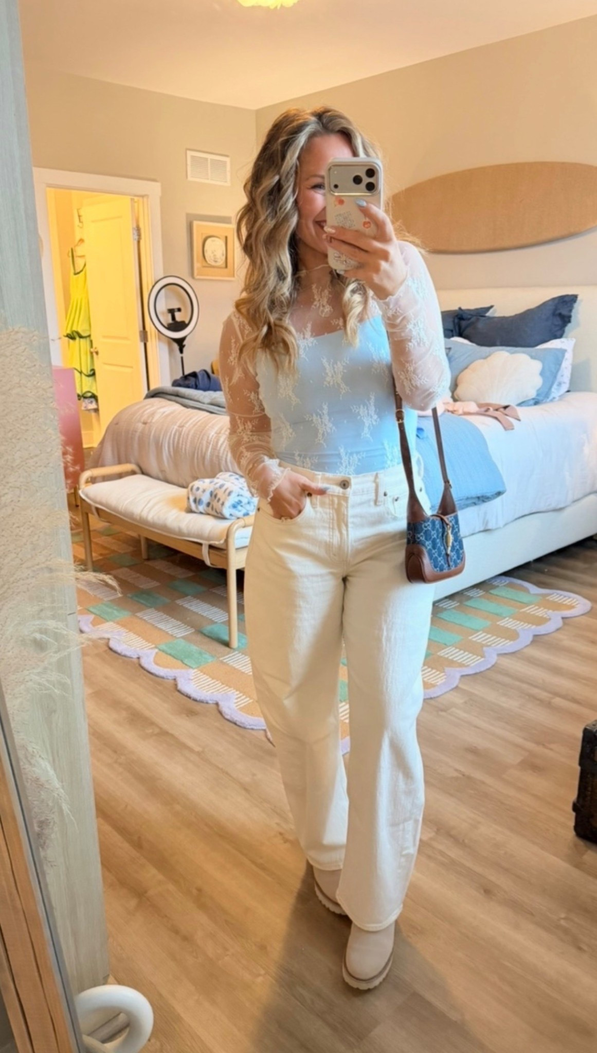 Soft, feminine, and a little coastal 🌊✨ #liketkit

This combo feels elevated but still so easy—sheer lace top layered over a tank + cream denim is one of those outfits that just works every time.

The textures make it feel special without trying too hard, and the neutral + soft blue palette is chef’s kiss 🤍

Perfect for brunch, date night, or anything where you want to feel put together but still comfortable.

Details:
• Sheer lace long sleeve (lightweight + delicate)
• Fitted tank underneath (layering essential)
• Cream straight leg denim (true to size)
• Neutral boots (go with everything)
• Mini crossbody bag