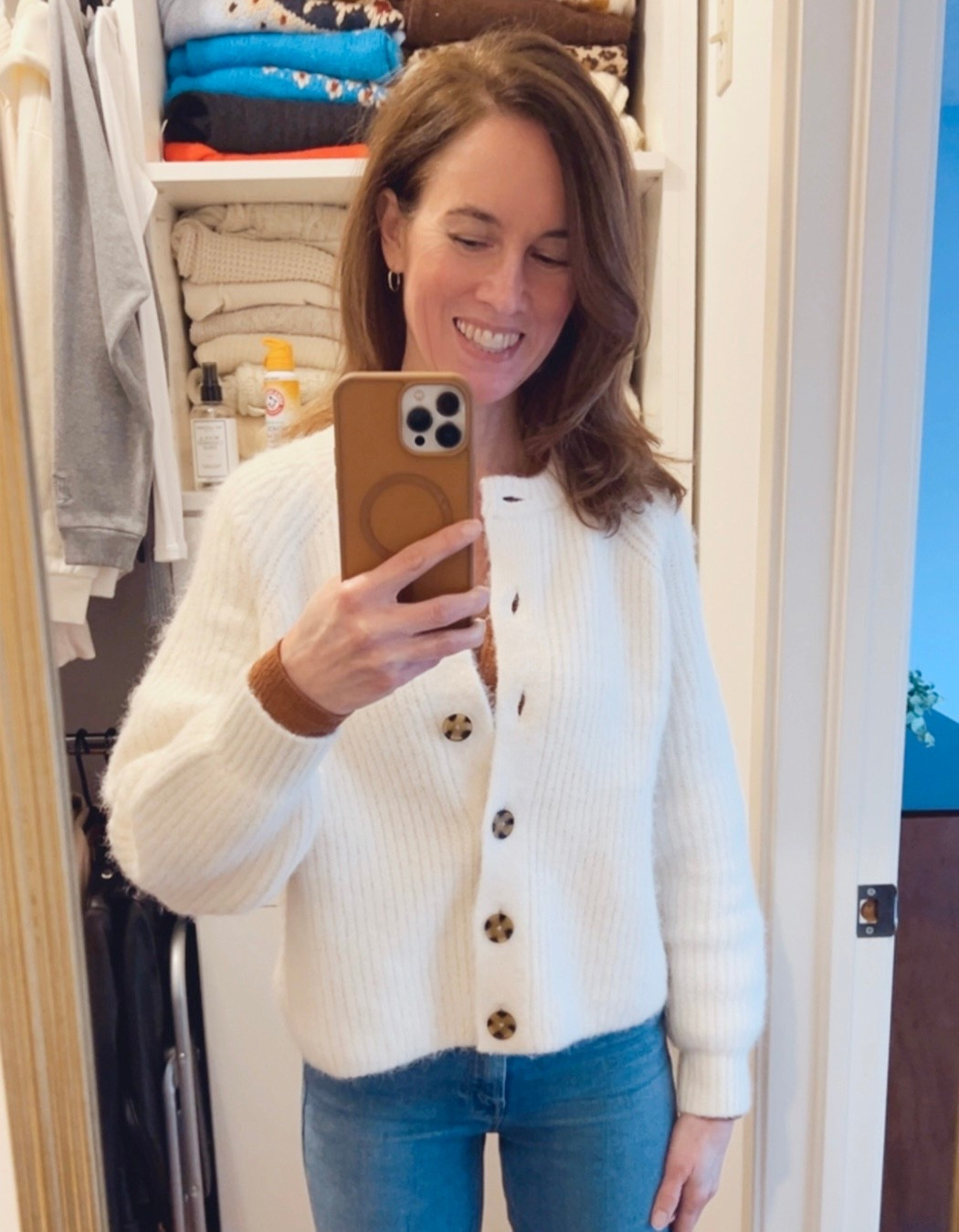 My Sweater of the Day: Best selling Abercrombie & Fitch Crew Cardigan in Off White (also in red, taupe, green, grey).  Styled with my Mother Denim Jeans, American Eagle AE Henley, and Old Navy ribbed tank.  Accessories include my BaubleBar gold hoop earrings and Gorjana chain necklace.  #sweateroftheday #OOTD #mystyle #MyOver40Style #sales #afterChristmasSales #WinterCardigan

#LTKootd #LTKFindsUnder100 #LTKOver40
