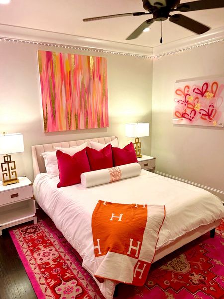 ❤️🙌🏻THE ultimate girl’s teen/tween/college bedroom!!
The orange and pink combo is so on trend right now!! 
All original artwork in room is by Mk Decker Designs (Mkdeckerdesigns.com)
Over the bed is 48x48  “Golden Hour” from the abstract collection (size 36x48 would be fine), 30x40 “Pink & Coral Hearts” from the Original heart art collection, and 2 Proverbs 31 Ladies from the new collection. 
Rug was size 9x12 
Bed was a queen 
Pillows were 2 of the 26x26 white velvet pillows from Amazon with 28x28 down inserts. 
22x22 Hot pink pillows and custom 36” bolster made from premier fabrics Jackson Ms 
(Linked similar hot pink pillows from Amazon)
Any other questions? Please message me! I’m happy to help!! 

#LTKstyletip #LTKhome #LTKsalealert
