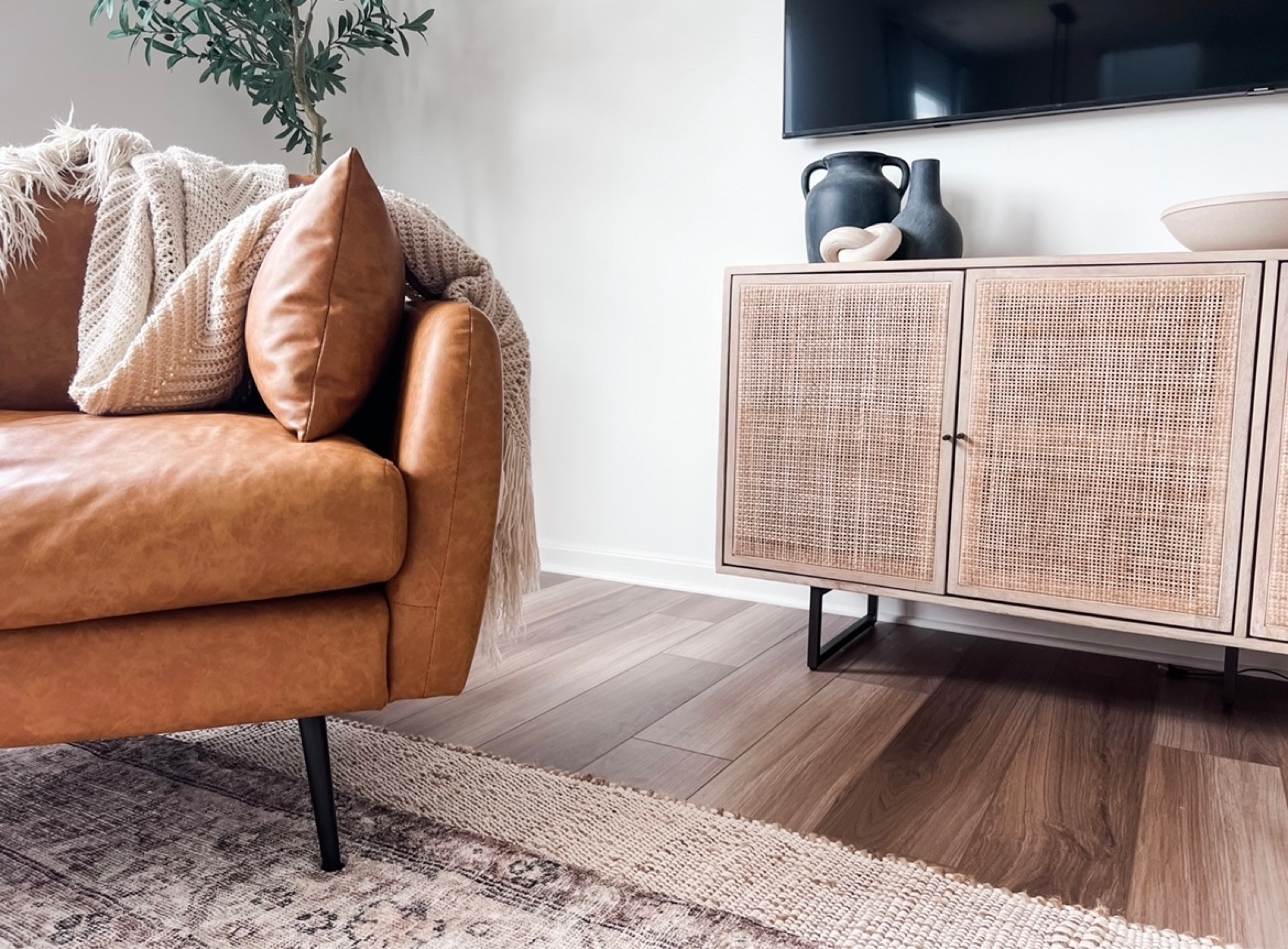 A view I love 🫶🏼 
Home, living room, cozy corner, accent chair, tv console, wood and cane console, sideboard 

#LTKhome