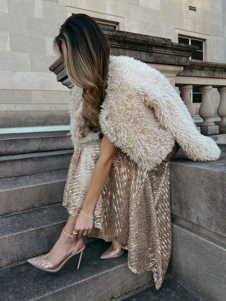 New Year’s Eve outfit inspo! Gold maxi dress gown fur coat and studded glitter Steve Madden heels! 

Holiday 
Birthday 
Black tie 
Gala 

#LTKSeasonal #LTKshoecrush #LTKHoliday