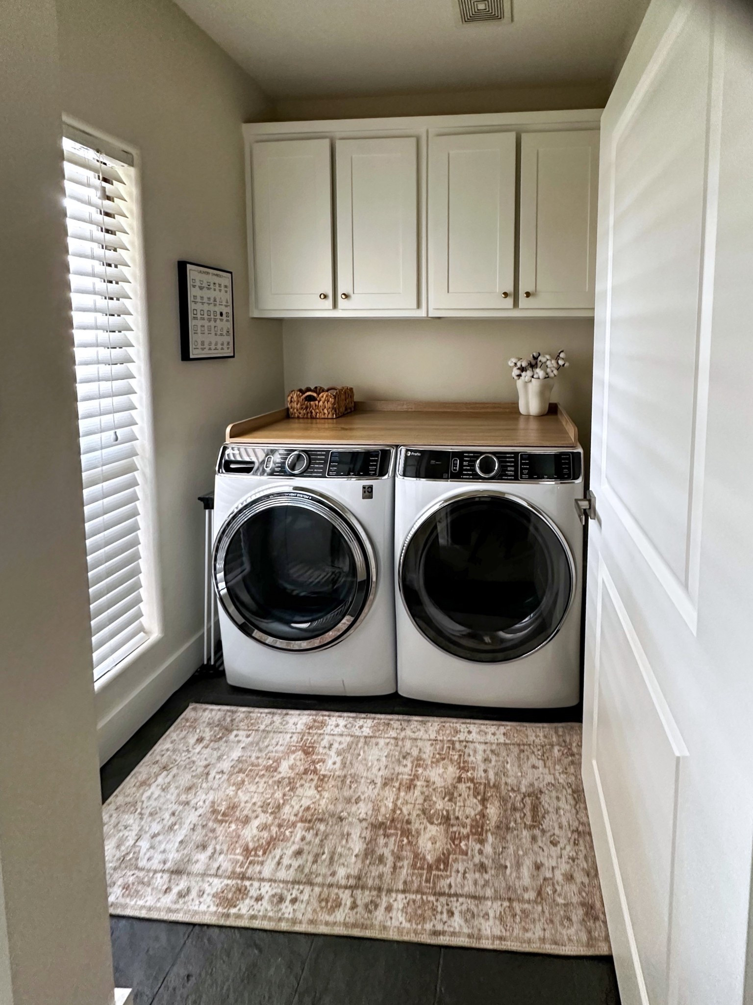 Bright + organized laundry room goals! ✨ Featuring front-load washer & dryer with a wood countertop, built-in cabinets for hidden storage, and a neutral vintage rug to warm up the space. Perfect small laundry room organization ideas for a clean + functional home

#LTKHome