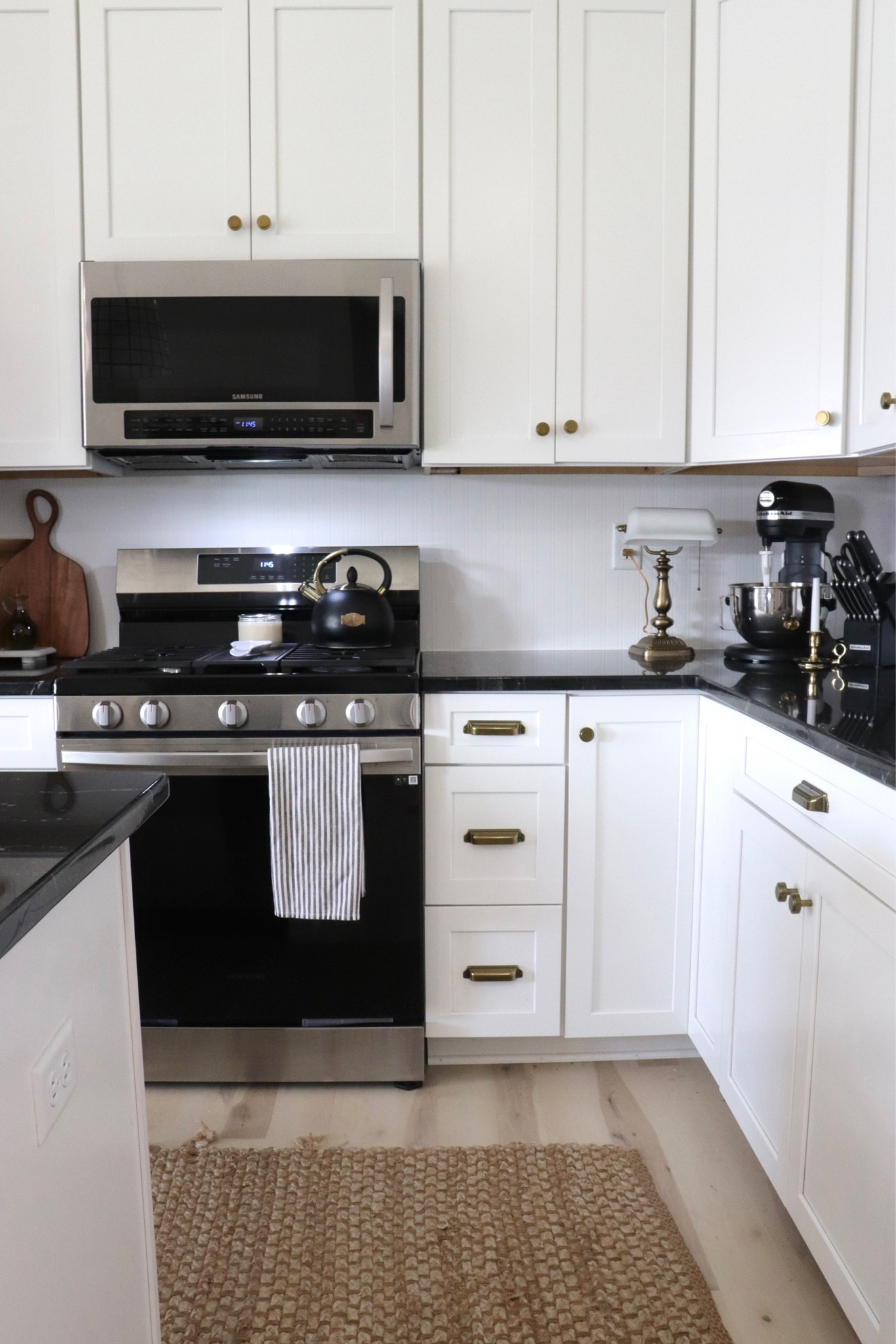 Kitchen decor. Neutral kitchen. Builder grade kitchen. Tea kettle. Vintage light. Vintage decor. Kitchen rug. Jute rug. Old-world decor. Vintage home decor. Cozy kitchen. 

#LTKhome #LTKfindsunder50 #LTKfindsunder100