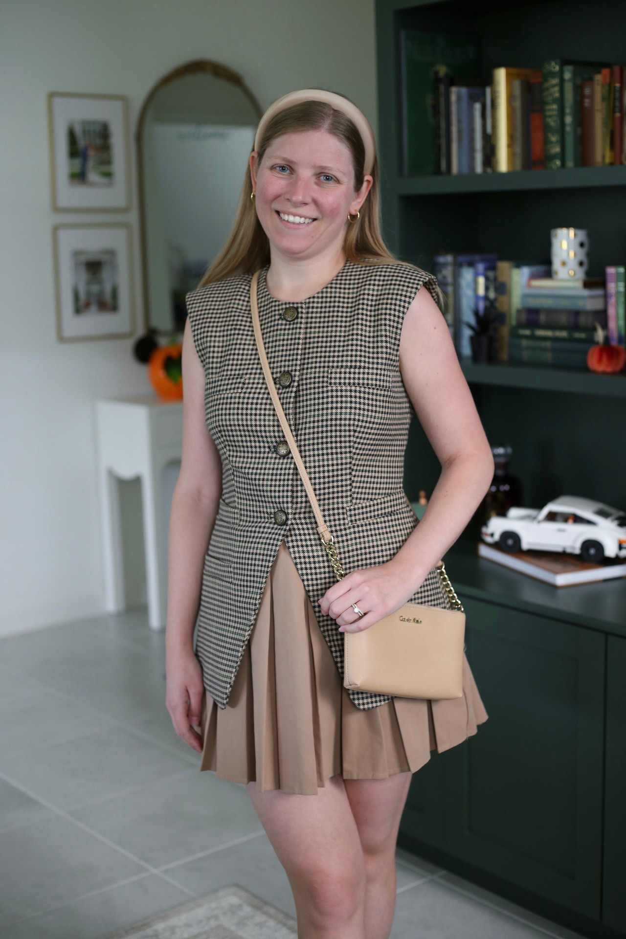 Pre-fall outfit. Tan pleated mini skirt and plaid vest top. How to style a waistcoat top  