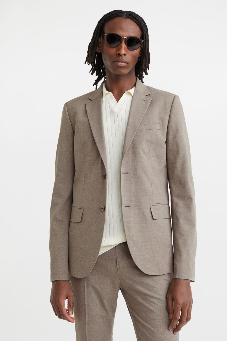 Single-breasted blazer in woven stretch fabric with narrow, notched lapels. Chest pocket, front p... | H&M (US + CA)