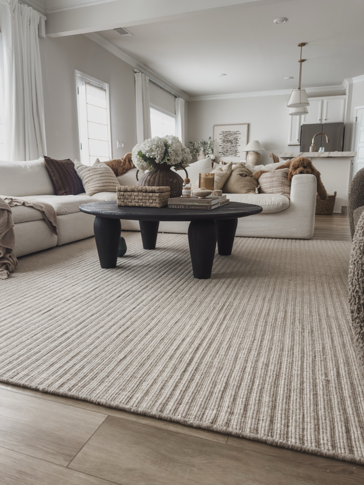 Sharing all of my open concept living room details! Featuring my wool rug that has held up so well in high traffic areas. The quality is 10/10. An oversized coffee table that is perfect for gathering and grounded the space.