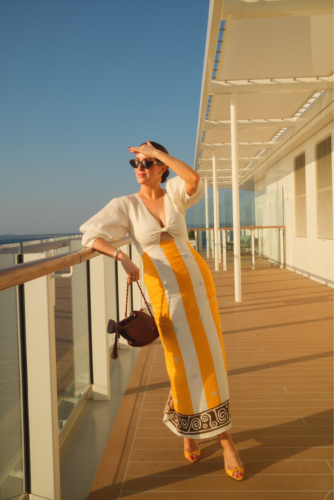 Golden hour calls for a golden look. ✨ I’ve been loving Cala de la Cruz pieces for so long, and I finally found the perfect one for our Mediterranean trip. I paired it with my shoe of the summer from Alexandre Birman, golden jewelry, and my favorite wooden SimonMiller bag for the perfect sunset look.
I’ve linked my dress, along with a few other favorites I was considering, plus my Alexandra Birman shoes (a few places still have limited stock!). My Simon Miller bag has been such a great investment this summer—I’ll let you know as soon as it’s back in stock, but I’ve linked a few similar styles in the meantime.

#LTKOver40 #LTKTravel #LTKootd