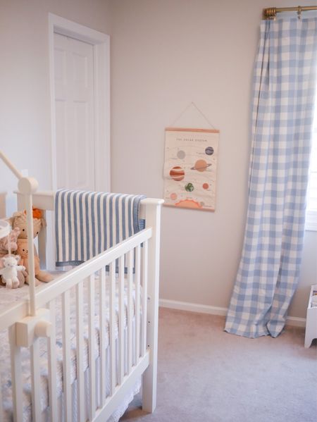 Baby boy nursery with blue gingham curtains and space art

#LTKhome #LTKbaby