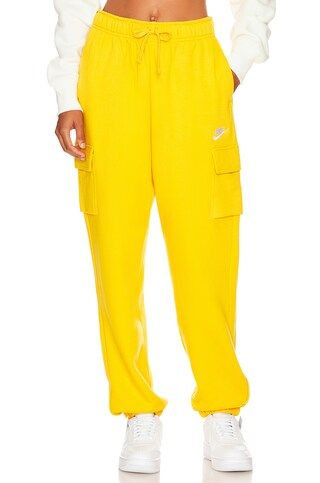 Nike NSW Club Cargo Sweatpant in Yellow Ochre & White from Revolve.com | Revolve Clothing (Global)