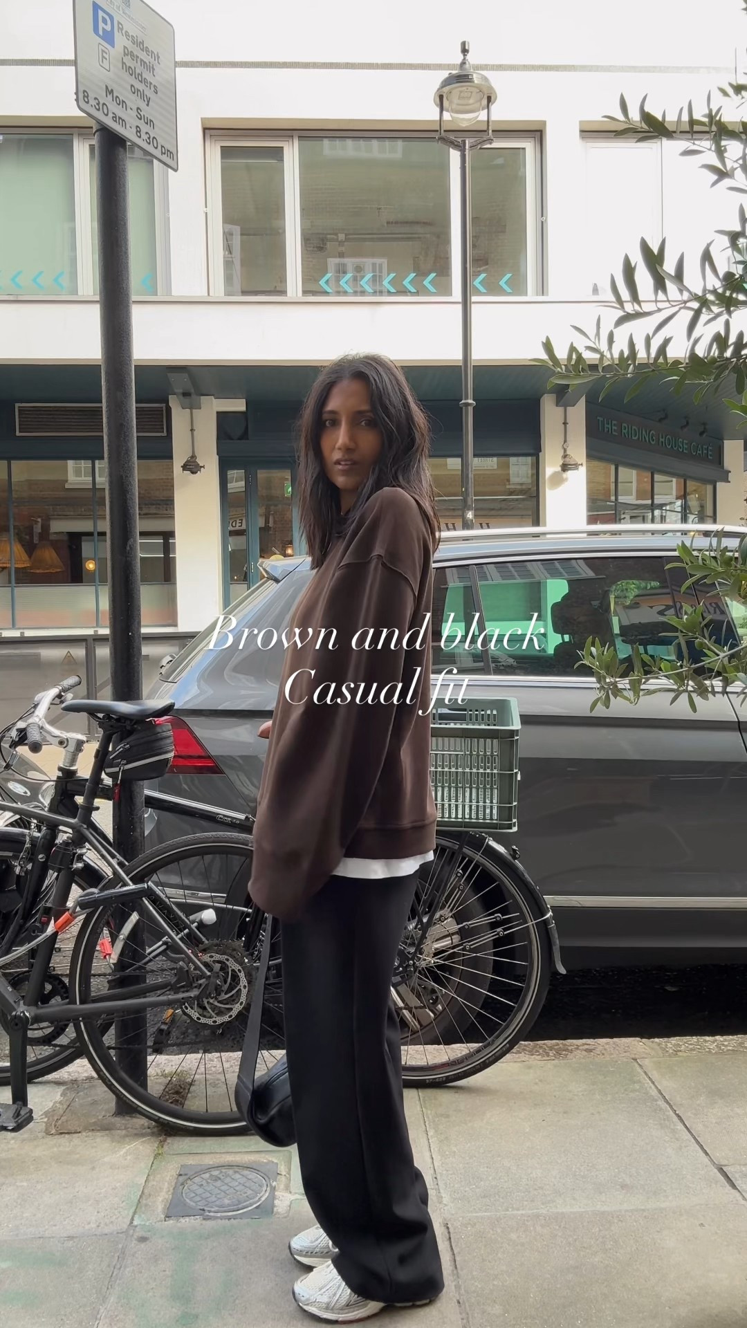 Brown and black, black trousers, sweatshirt, smart casual 