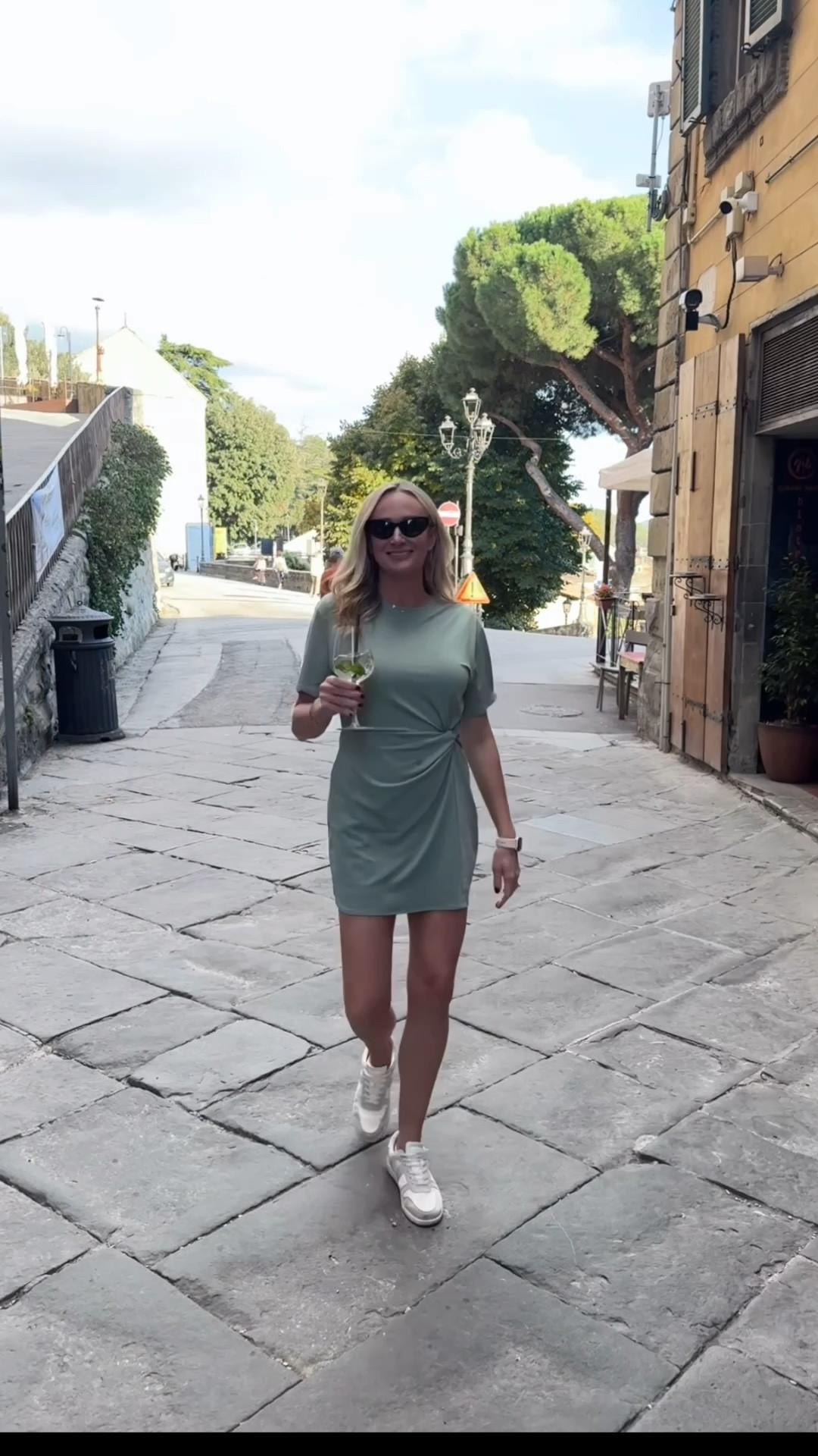 Casual chic for sightseeing days 💚 This knot-front dress is comfy yet polished- perfect for walking tours, travel days, or weekend errands. This Abercrombie dress is on clearance now too! 

sage green dress, travel outfit idea, casual day dress, summer to fall outfit, walking outfit inspo, sneaker outfit, minimalist travel fashion, comfy chic outfit, neutral travel style, Italy travel, Europe travel outfit 

#LTKOver40 #LTKSaleAlert #LTKFindsUnder50