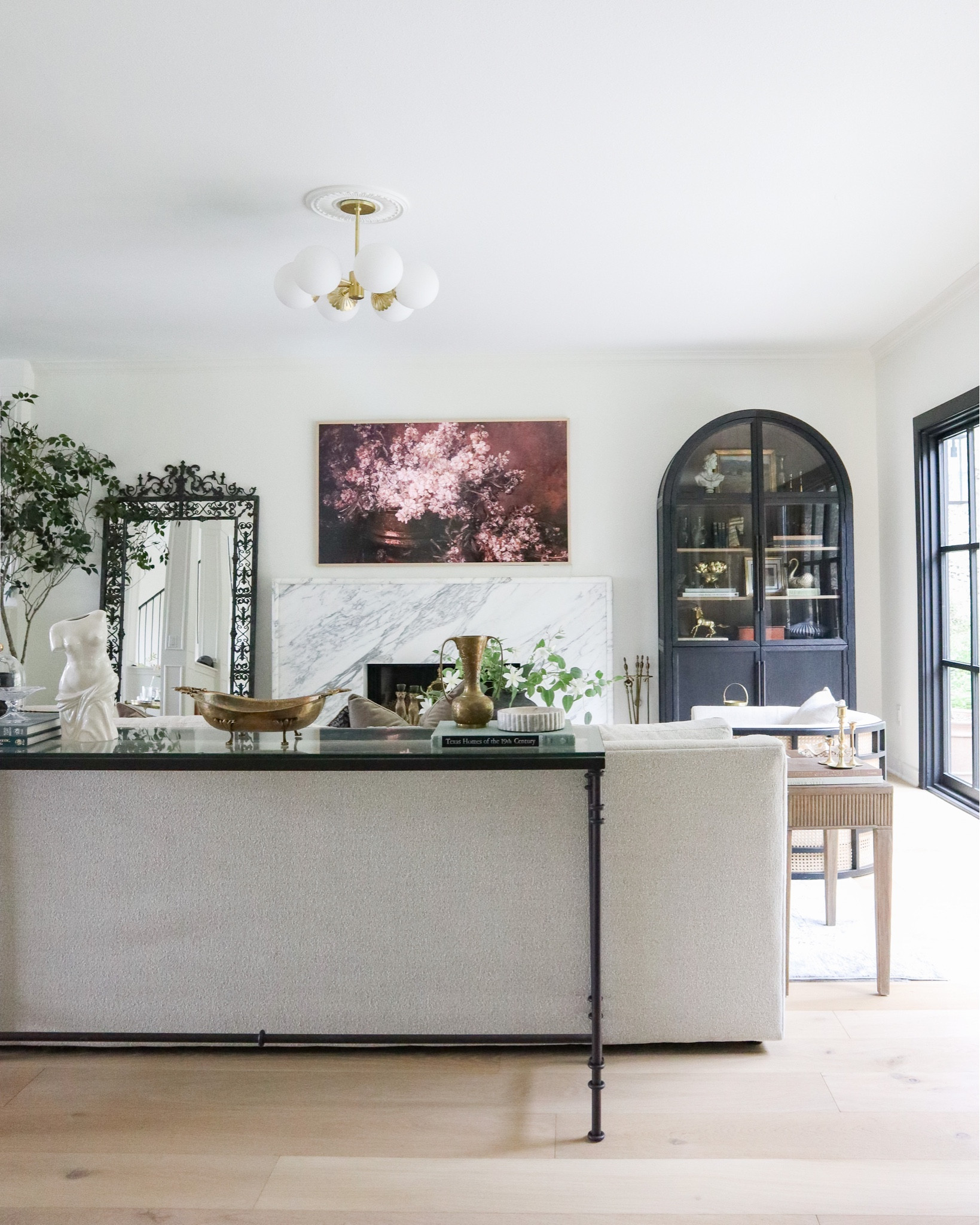 Statement pieces in our living room — ornate iron mirror, 75” Frame TV, and Arhaus Hattie cabinet!

#LTKsalealert #LTKhome #LTKstyletip