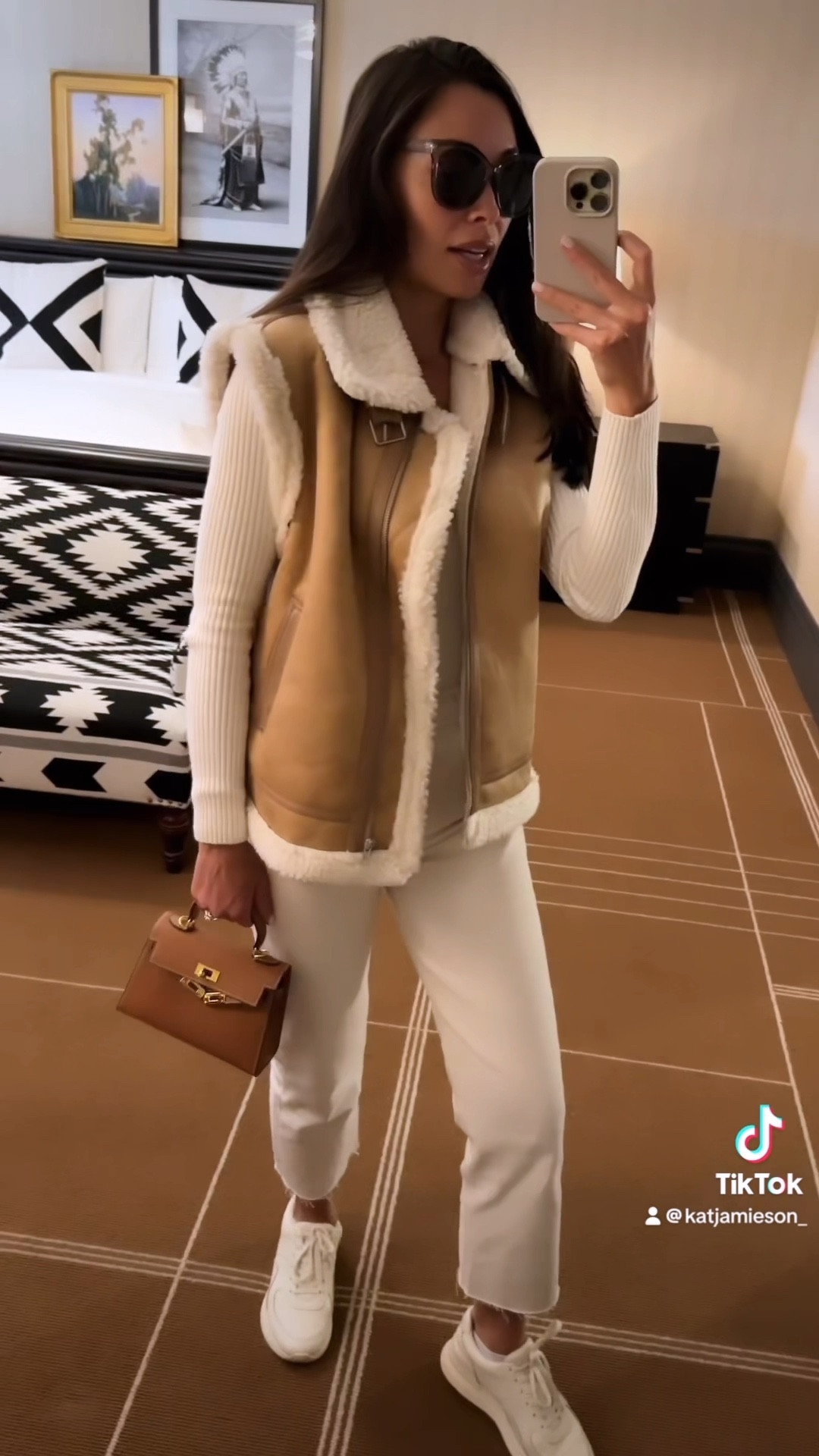 Kat Jamieson wears a shearling vest, bodysuit, denim jeans and sneakers in Aspen. What to wear in Aspen, spring outfit, sneaker outfit, casual style. 

#LTKshoecrush #LTKSeasonal #LTKtravel