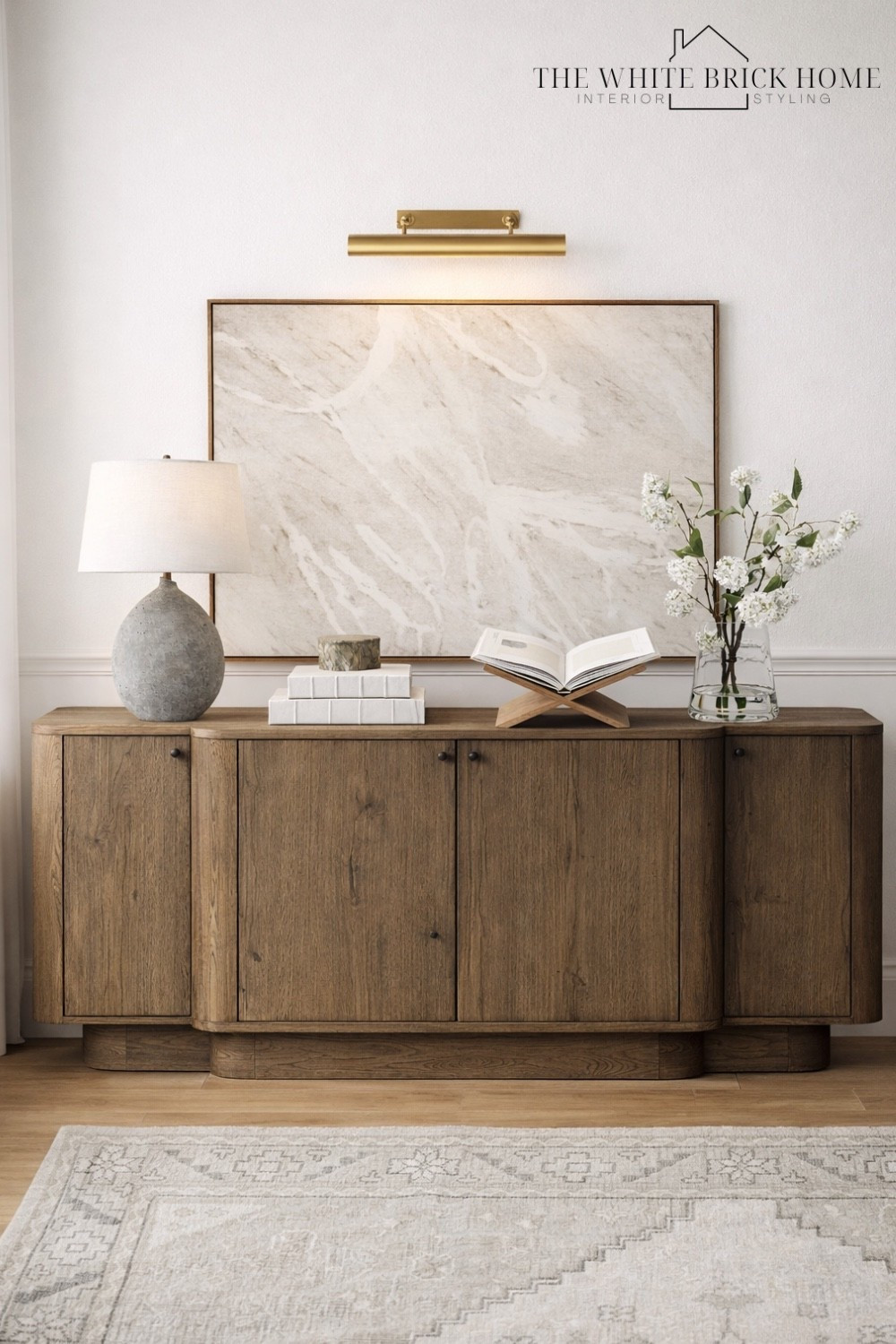 A timeless console moment - warm wood, soft whites, and elevated styling tha makes your living room or entry feel effortlessly finished. 

Living room, living room cabinet, console table, buffet table, wall art, picture like, table lamp, lamp, faux greenery, home decor, home design, living room design, living room decor ideas, area rug, living room rug, living room design, home accessories, home accents, home finds, McGee and co living room, living room ideas, living room inspiration. 

#LTKHome #LTKSaleAlert #LTKSeasonal